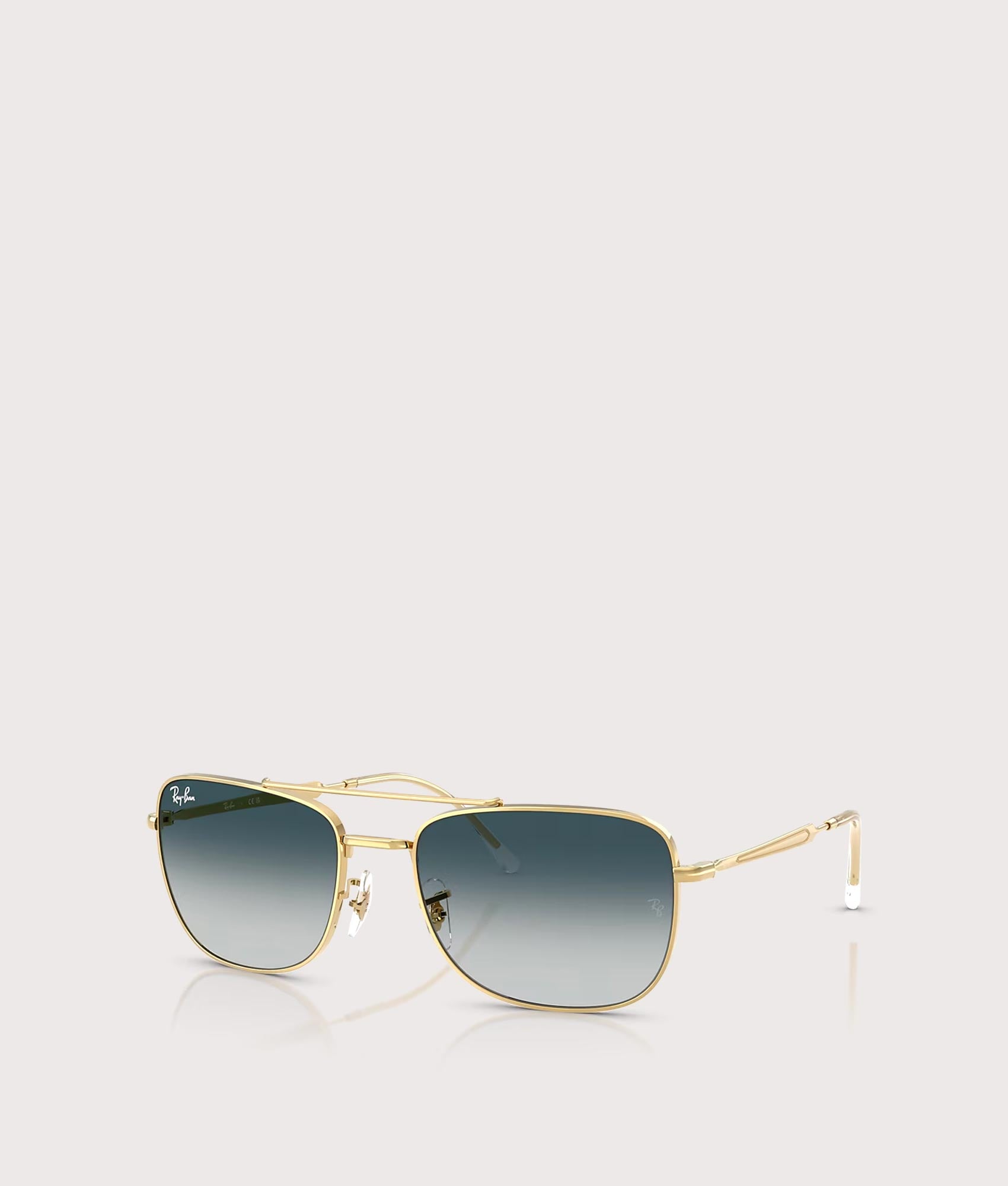 Ray-Ban RB3755 Sunglasses in Polished Arista Gold with Grey Gradient Blue lenses at EQVVS Menswear. Angled front shot.