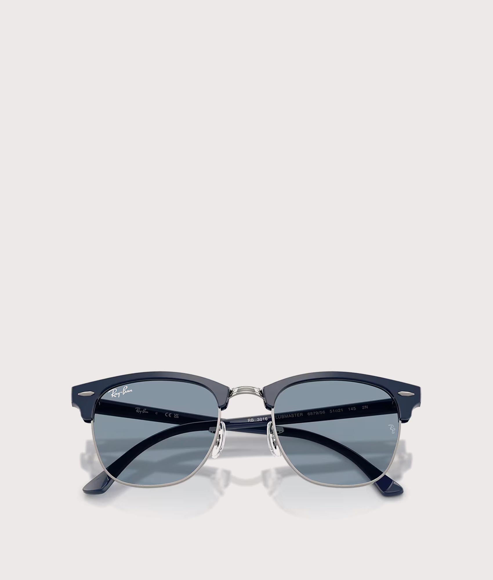 Clubmaster Classic Sunglasses in Matte Blue & Gunmetal-Blue Lens by Ray-Ban. Shot by EQVVS. Folded shot.