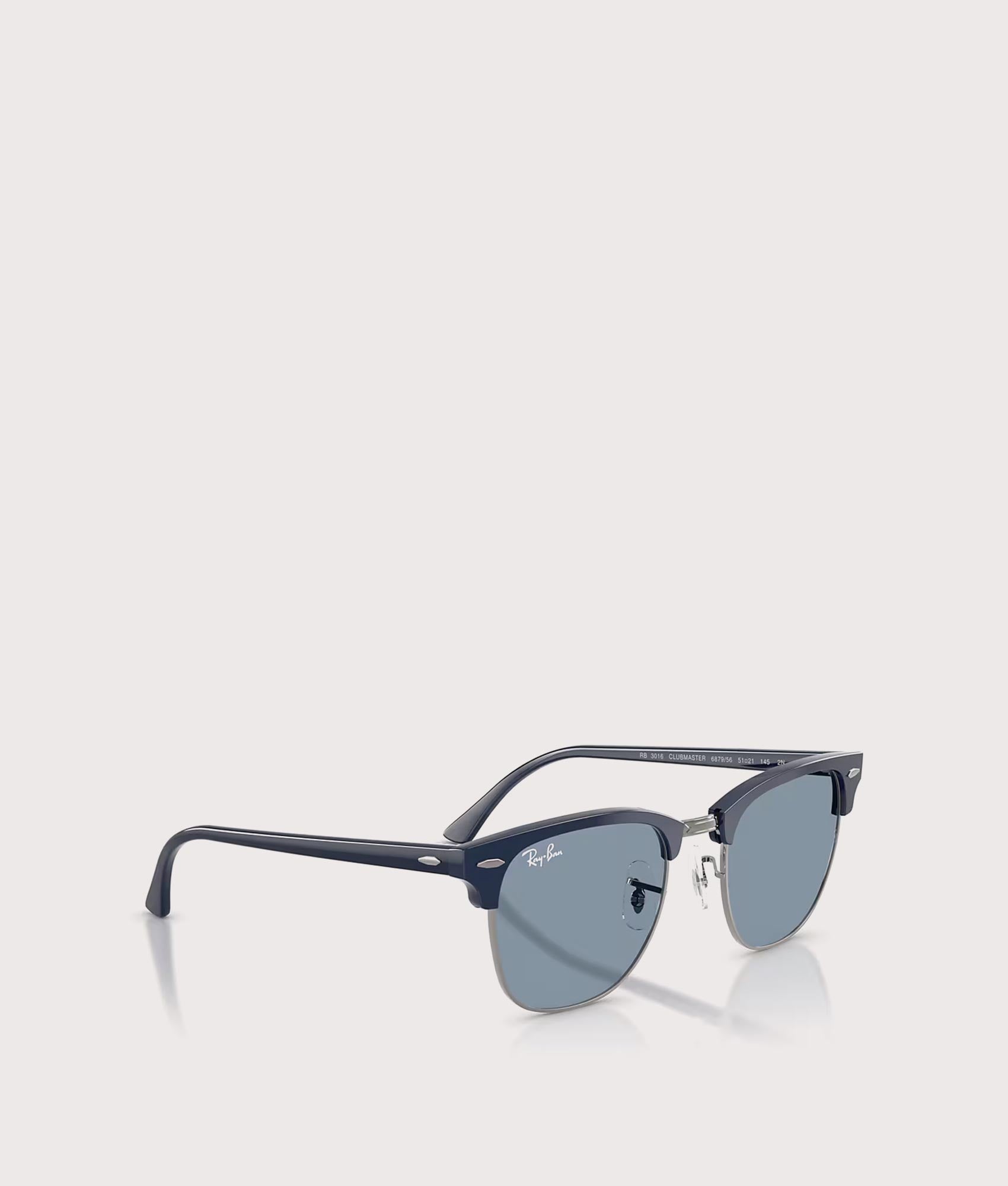 Clubmaster Classic Sunglasses in Matte Blue & Gunmetal-Blue Lens by Ray-Ban. Shot by EQVVS. Angled shot.