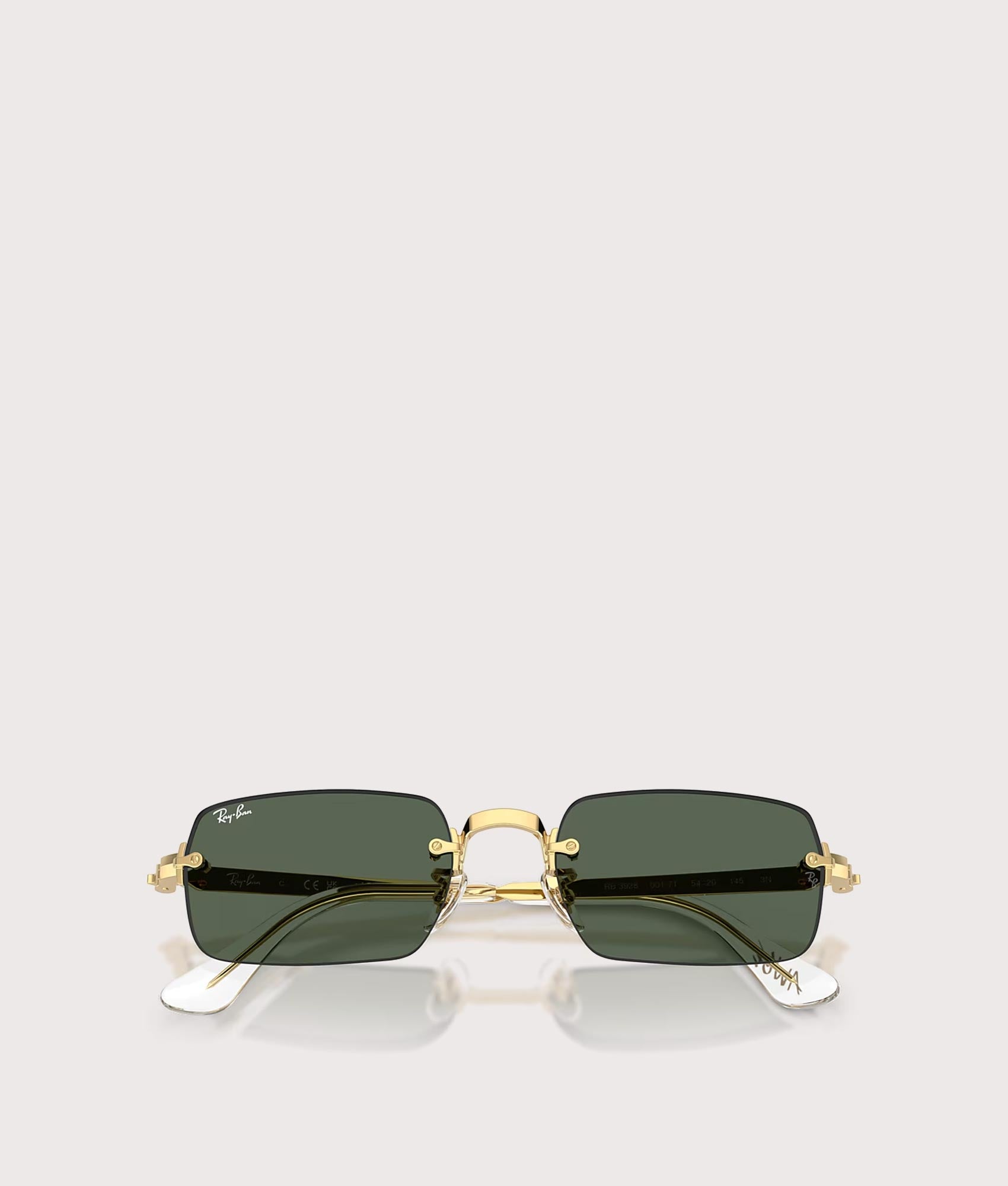Ray-Ban RB3928 By A$AP Rocky Sunglasses in 001/71 Arista gold colourway with Dark Green lenses at EQVVS Menswear. Folded shot.