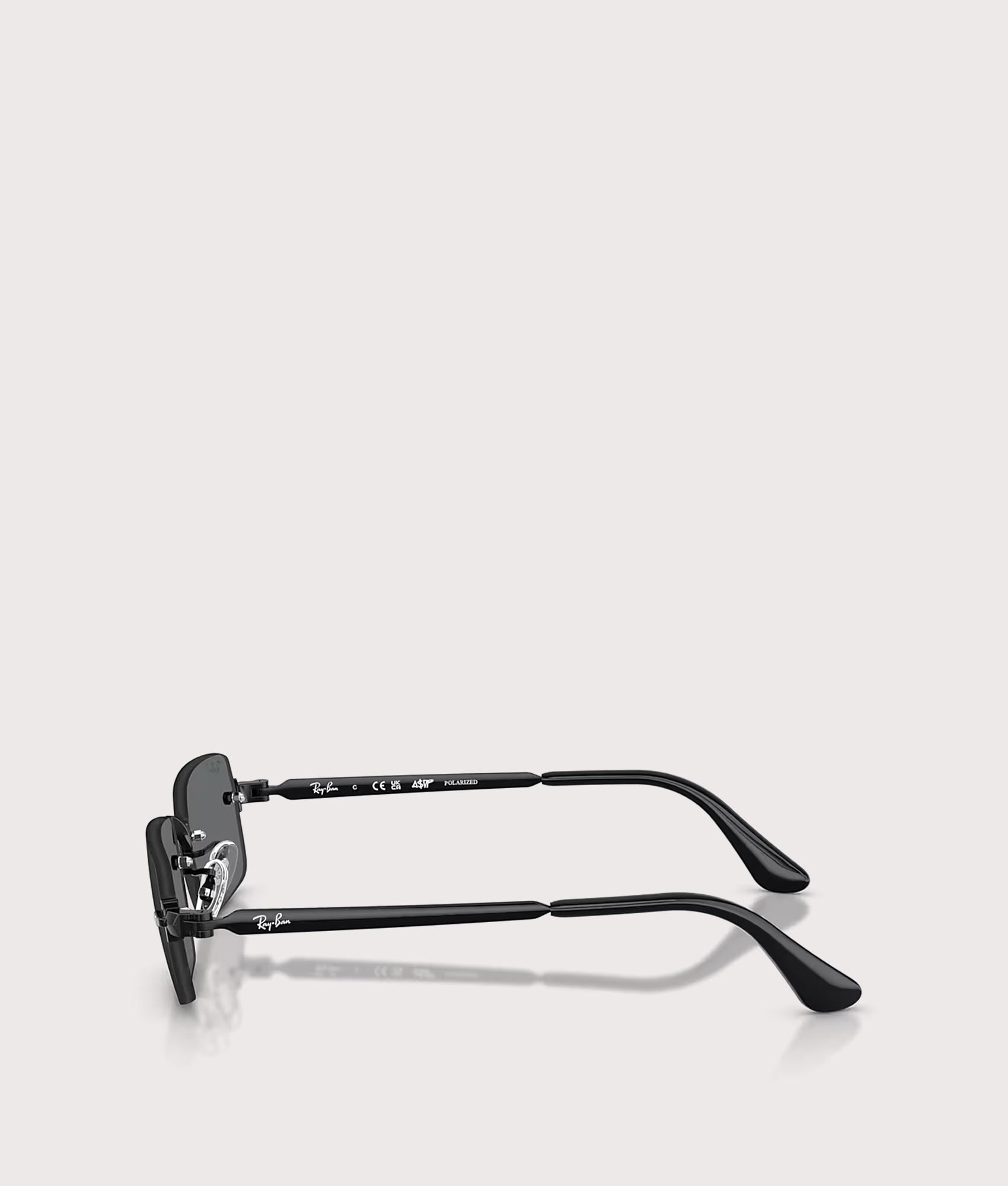 Ray-Ban RB3928 By A$AP Rocky Sunglasses in Polished Black colourway with Dark Grey Polarized lens at EQVVS Menswear. Side shot.