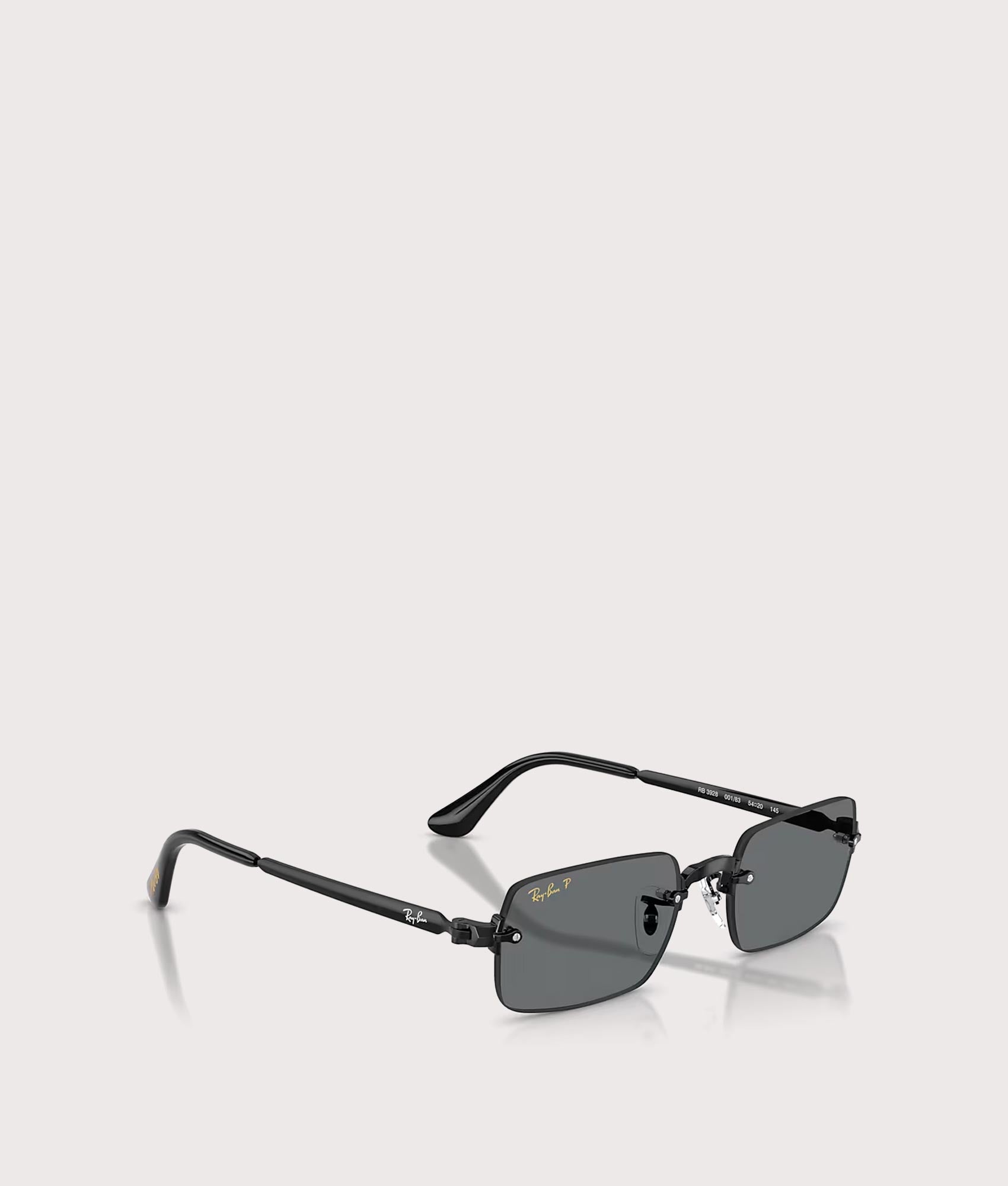 Ray-Ban RB3928 By A$AP Rocky Sunglasses in Polished Black colourway with Dark Grey Polarized lens at EQVVS Menswear. Side shot.