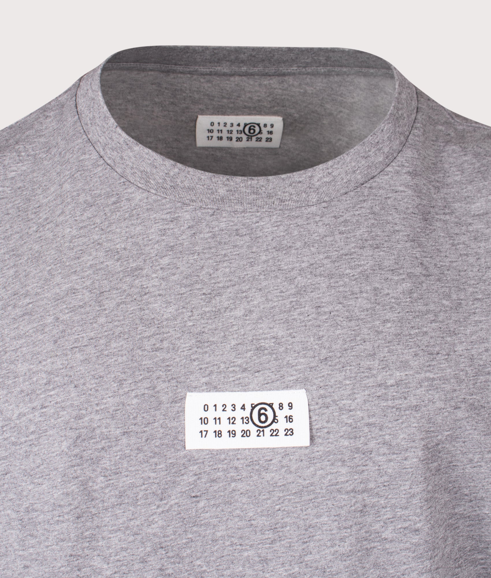MM6 Maison Margiela Numeric Cotton T-Shirt in Light Grey Melange at EQVVS Menswear. Detail Shot.