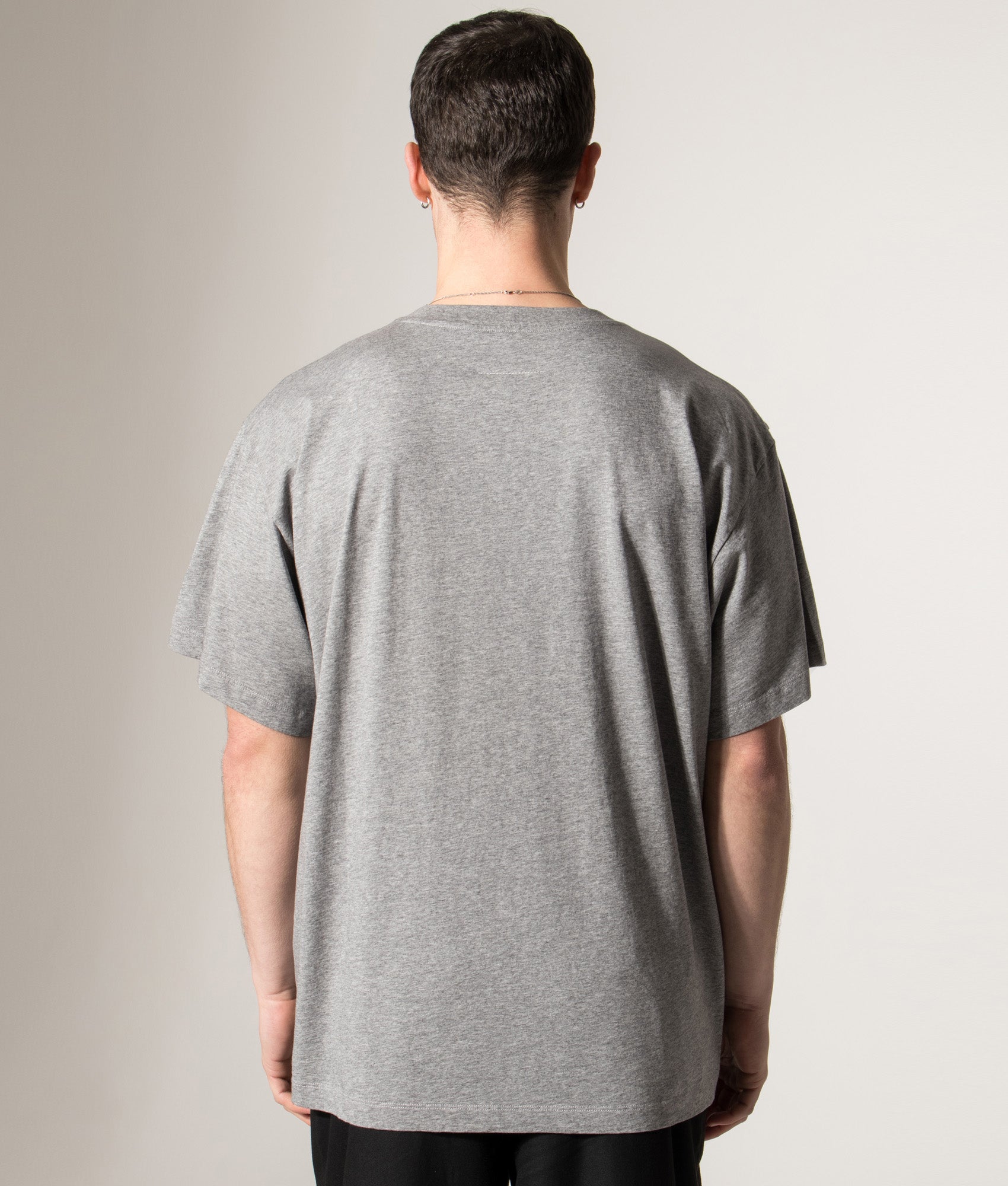 MM6 Maison Margiela Numeric Cotton T-Shirt in Light Grey Melange at EQVVS Menswear. Model back shot.