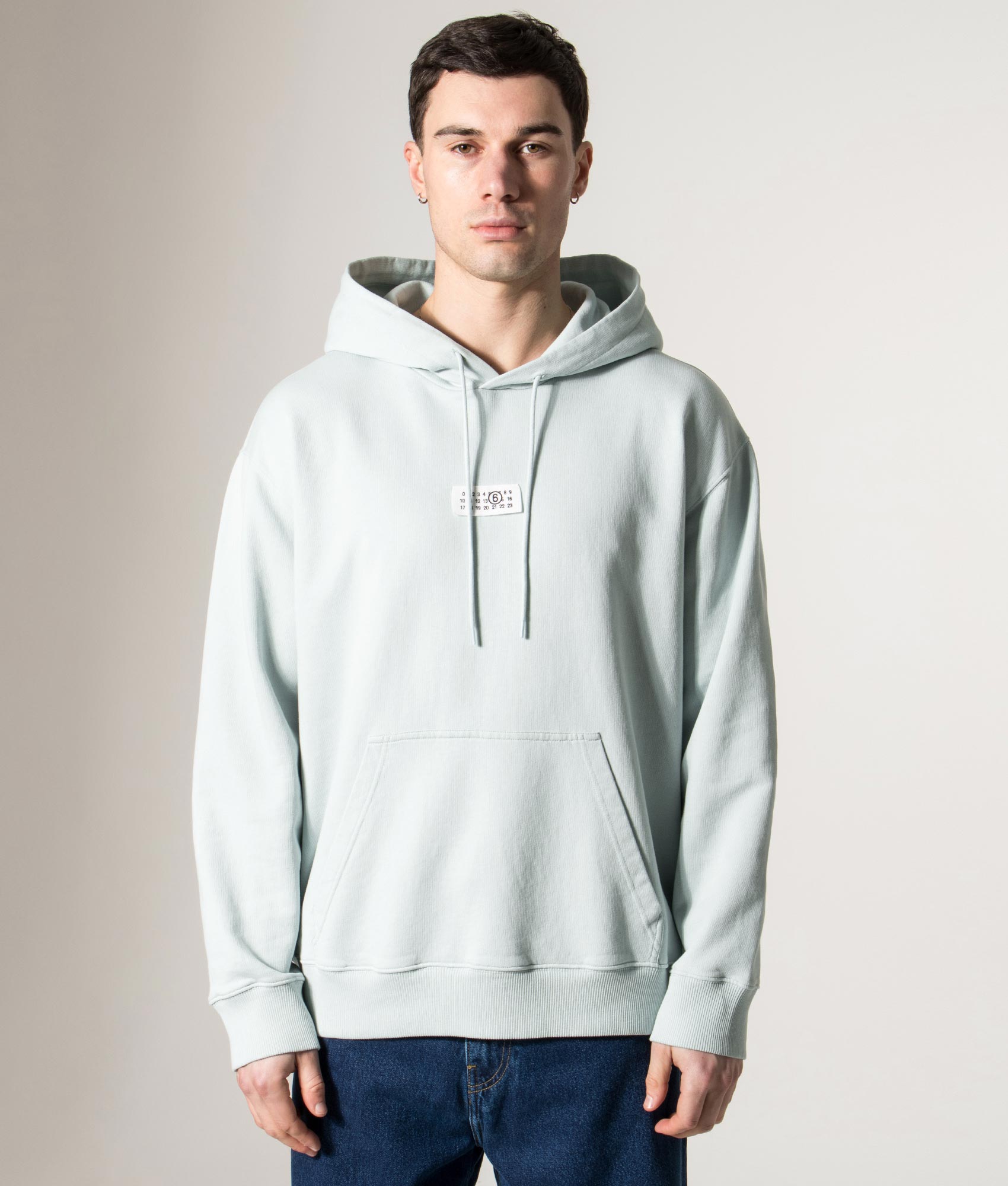 MM6 Maison Margiela Numeric Sweatshirt in Light Turquoise at EQVVS Menswear. Model front shot.