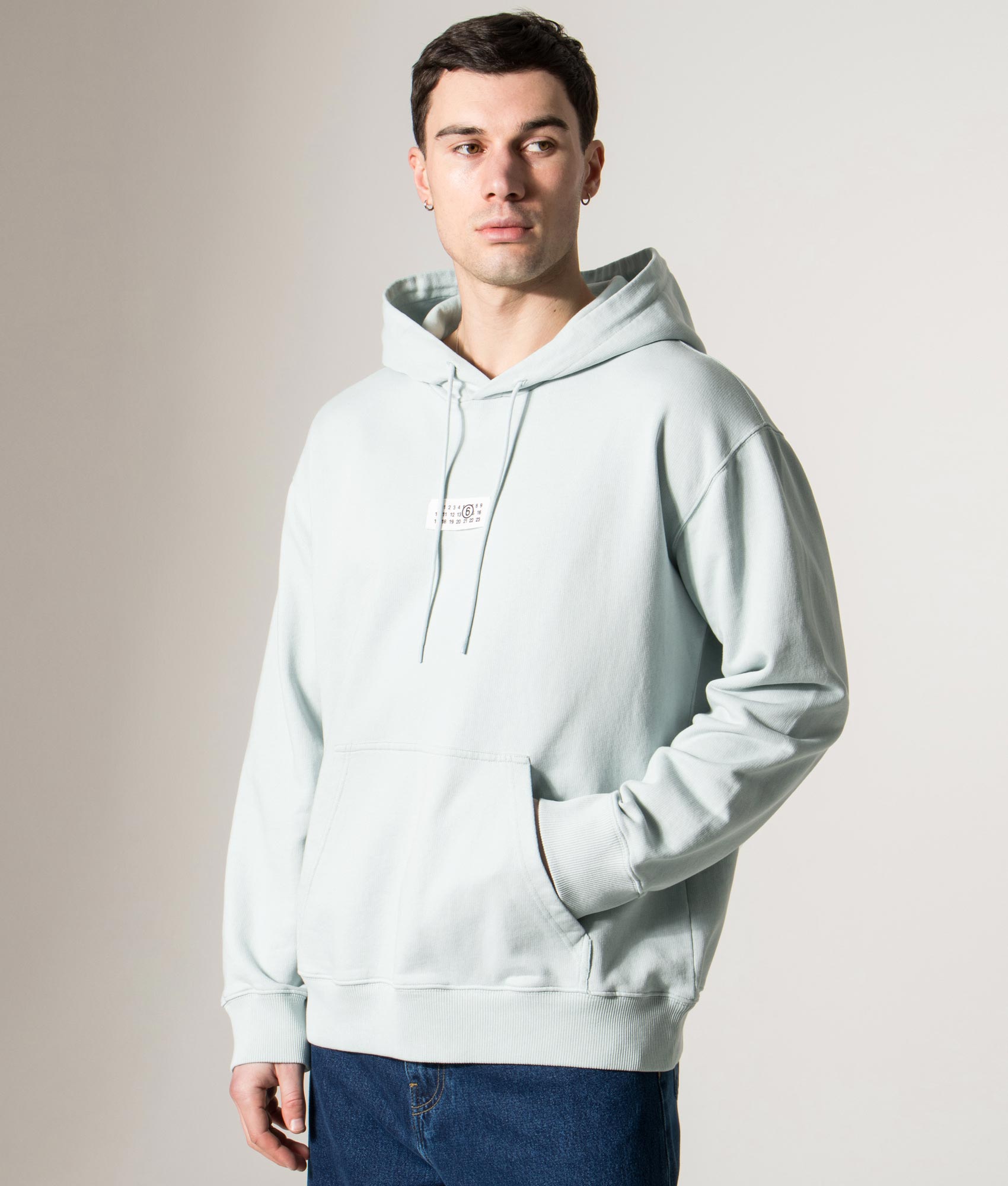 MM6 Maison Margiela Numeric Sweatshirt in Light Turquoise at EQVVS Menswear. Model front shot.