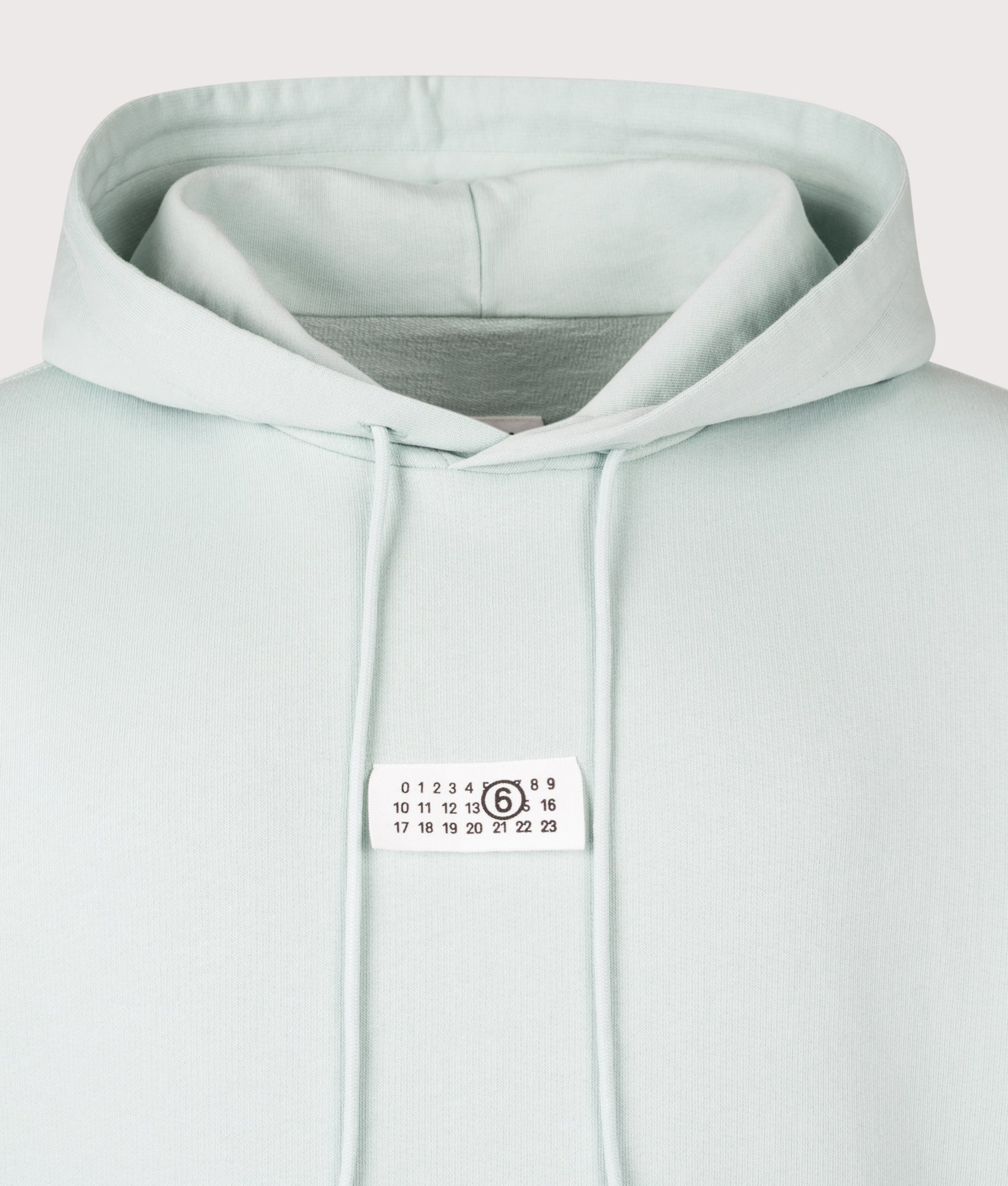 MM6 Maison Margiela Numeric Sweatshirt in Light Turquoise at EQVVS Menswear. Detail shot.