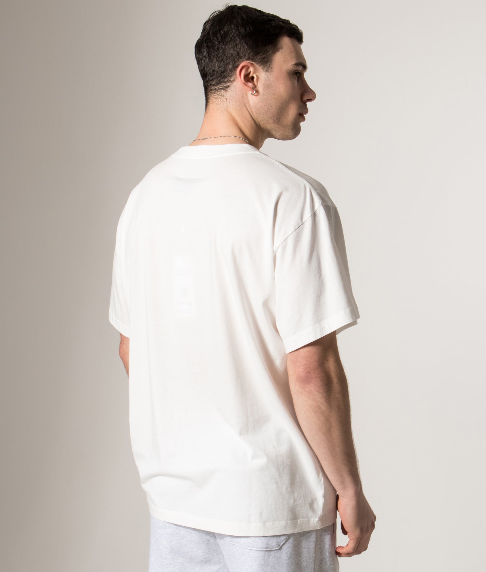 MM6 Maison Margiela Numeric Cotton T-Shirt in Off White at EQVVS Menswear. Model back shot.