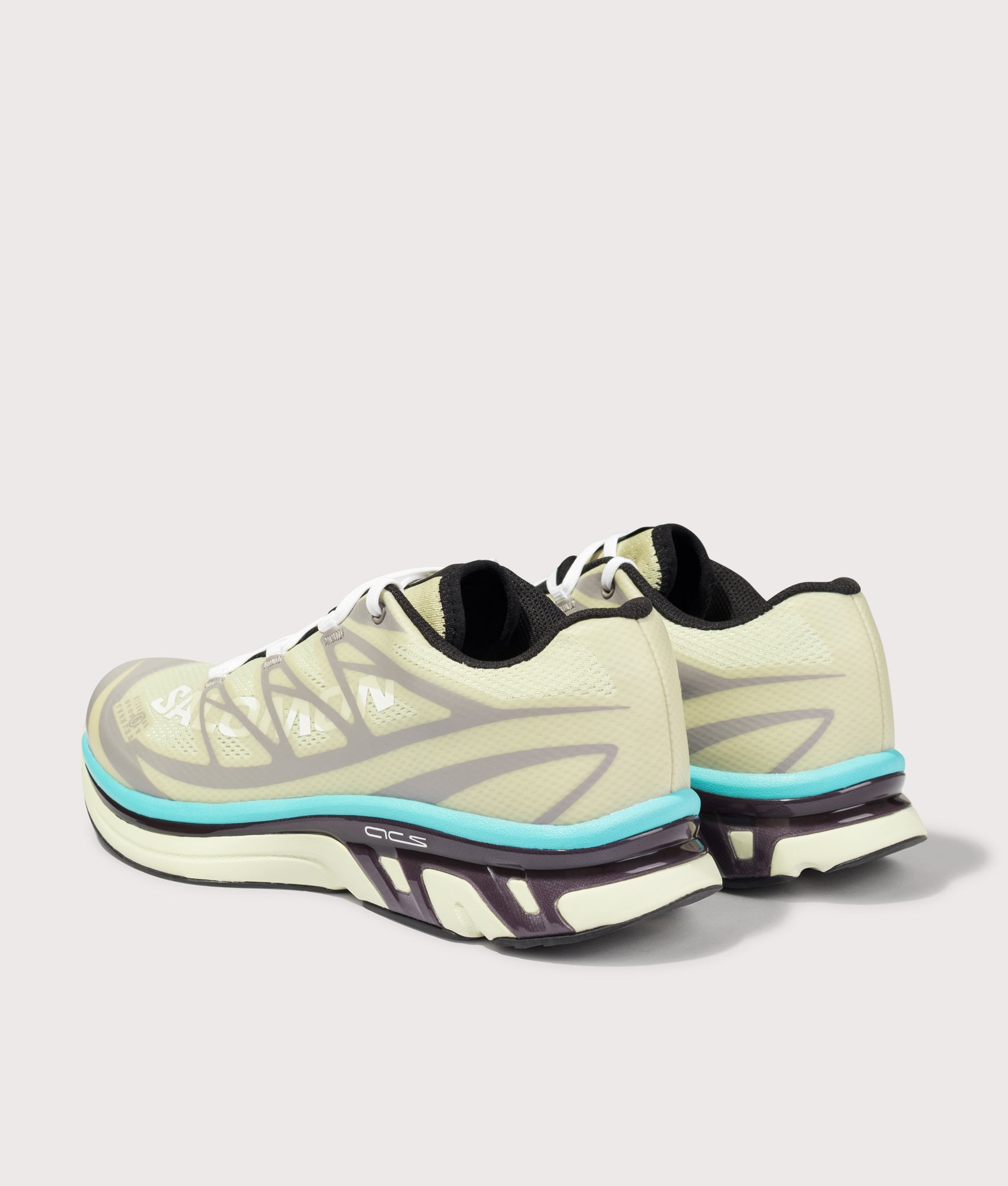 MM6 X Salomon XT Sneakers in Asparagus Green/Gull/Blue Curacao by MM6 Maison Margiela. Shot by EQVVS. Back shot.