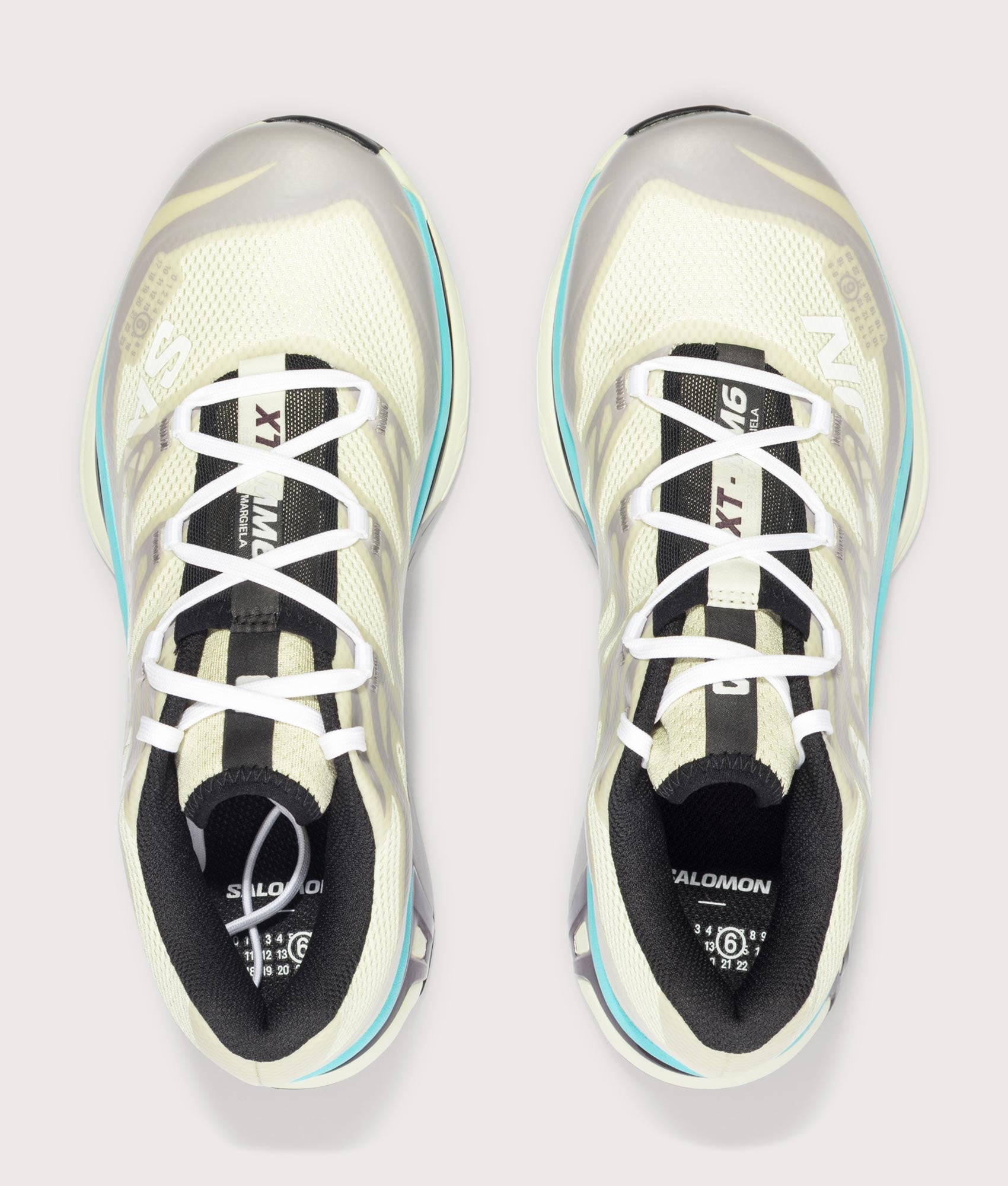 MM6 X Salomon XT Sneakers in Asparagus Green/Gull/Blue Curacao by MM6 Maison Margiela. Shot by EQVVS. Arial shot.