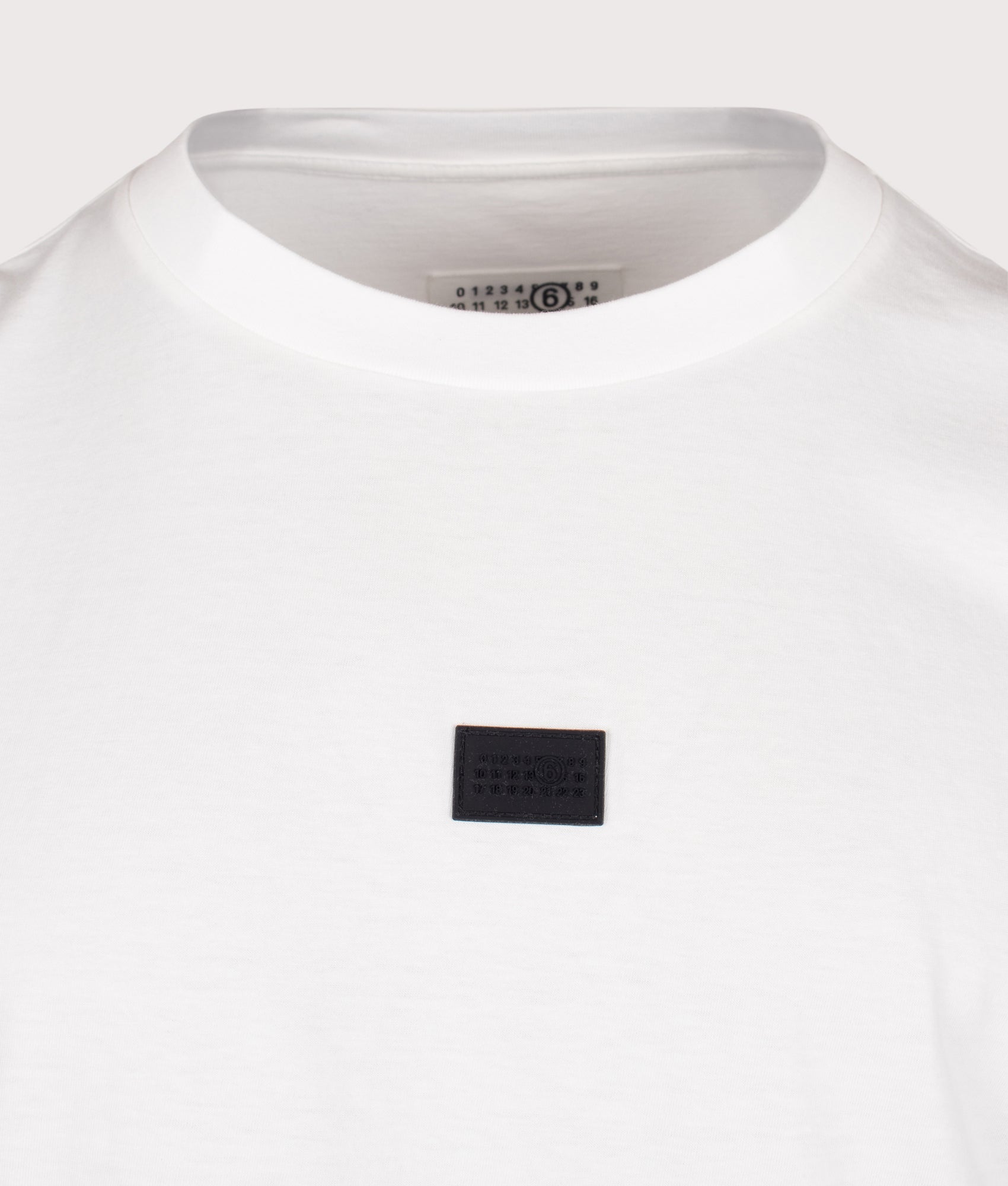 MM6 Maison Margiela Relaxed Fit Numeric T-Shirt in White at EQVVS Menswear. Detail shot.