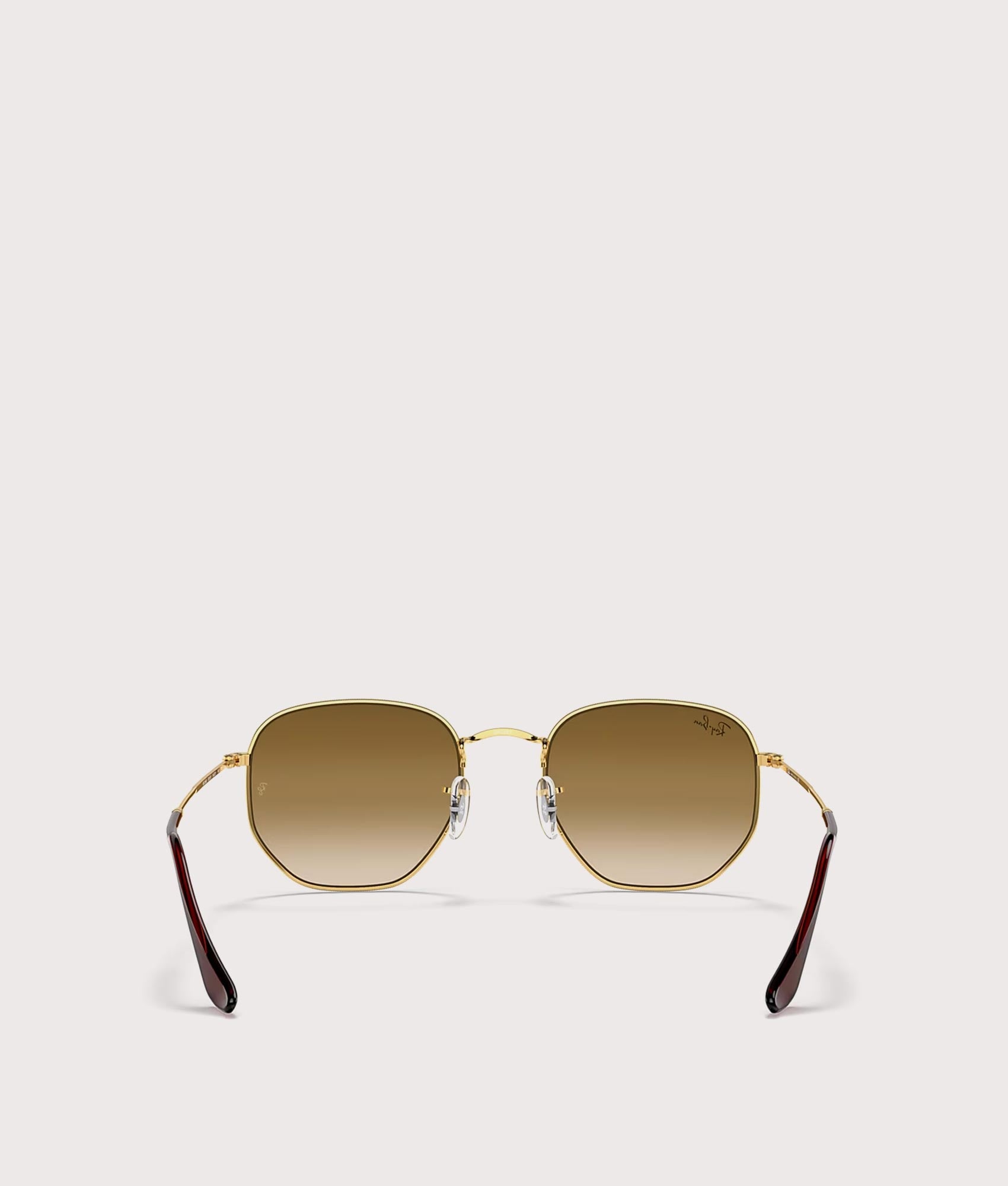Hexagonal Flat Lens Sunglasses in Polished Arista Gold-Brown Lens by Ray-Ban. Shot by EQVVS. Back shot.
