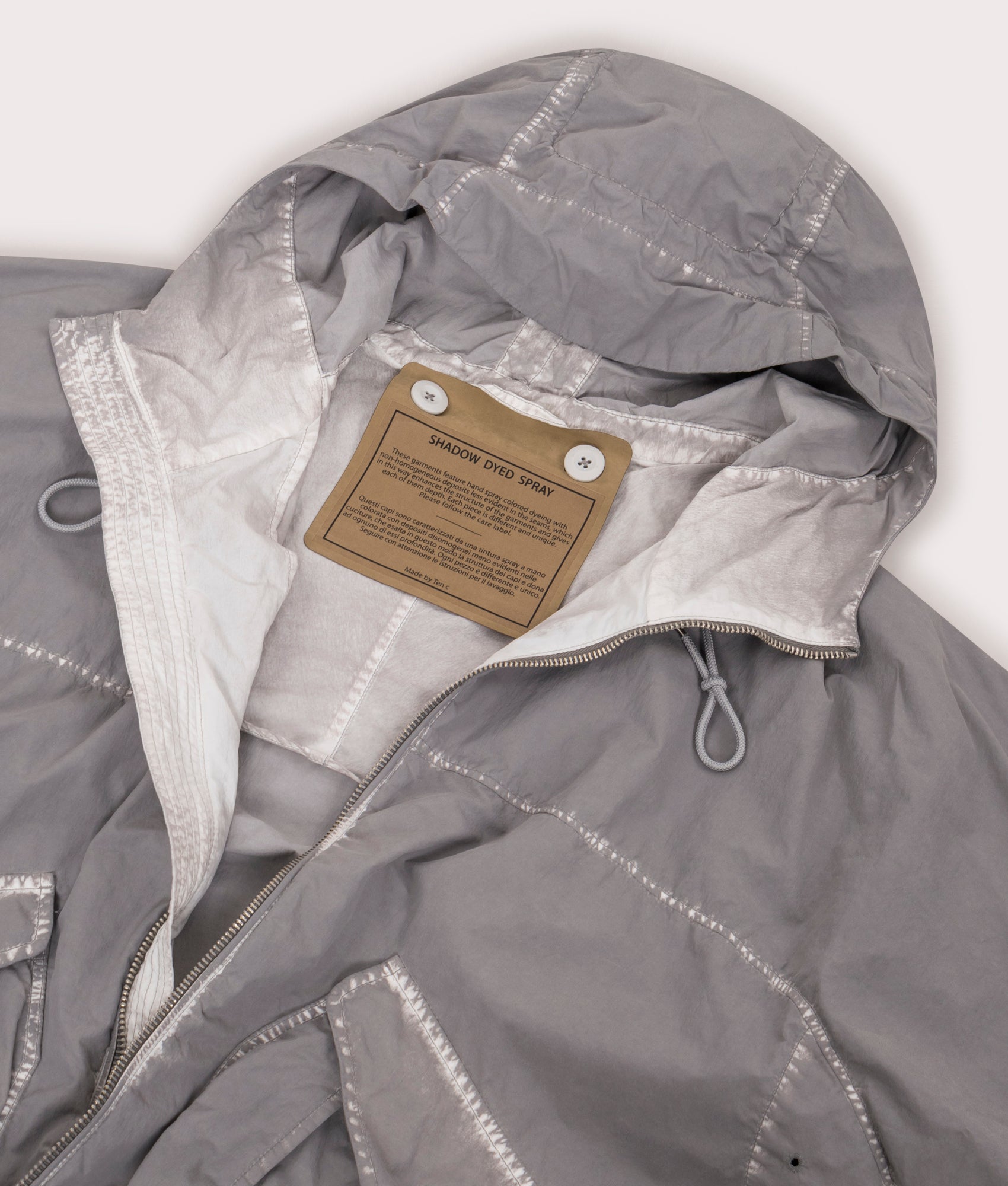 Shadow Dyed Short Jacket in Pale Taupe by Ten C at EQVVS Menswear. Hood Detail Shot.