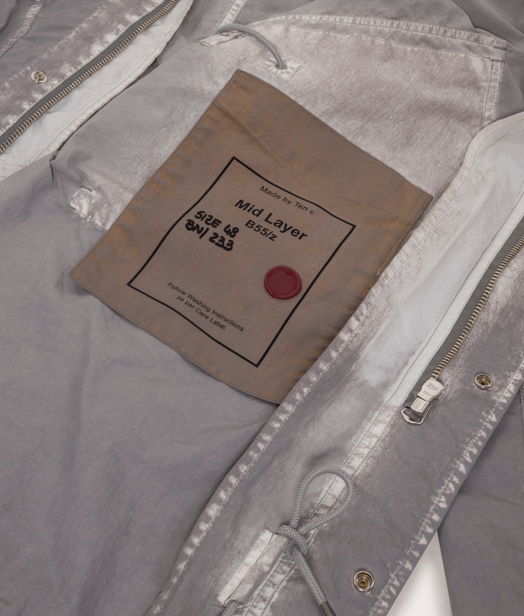 Shadow Dyed Long Raincoat in Pale Taupe by Ten C at EQVVS Menswear. Inside Detail Shot.