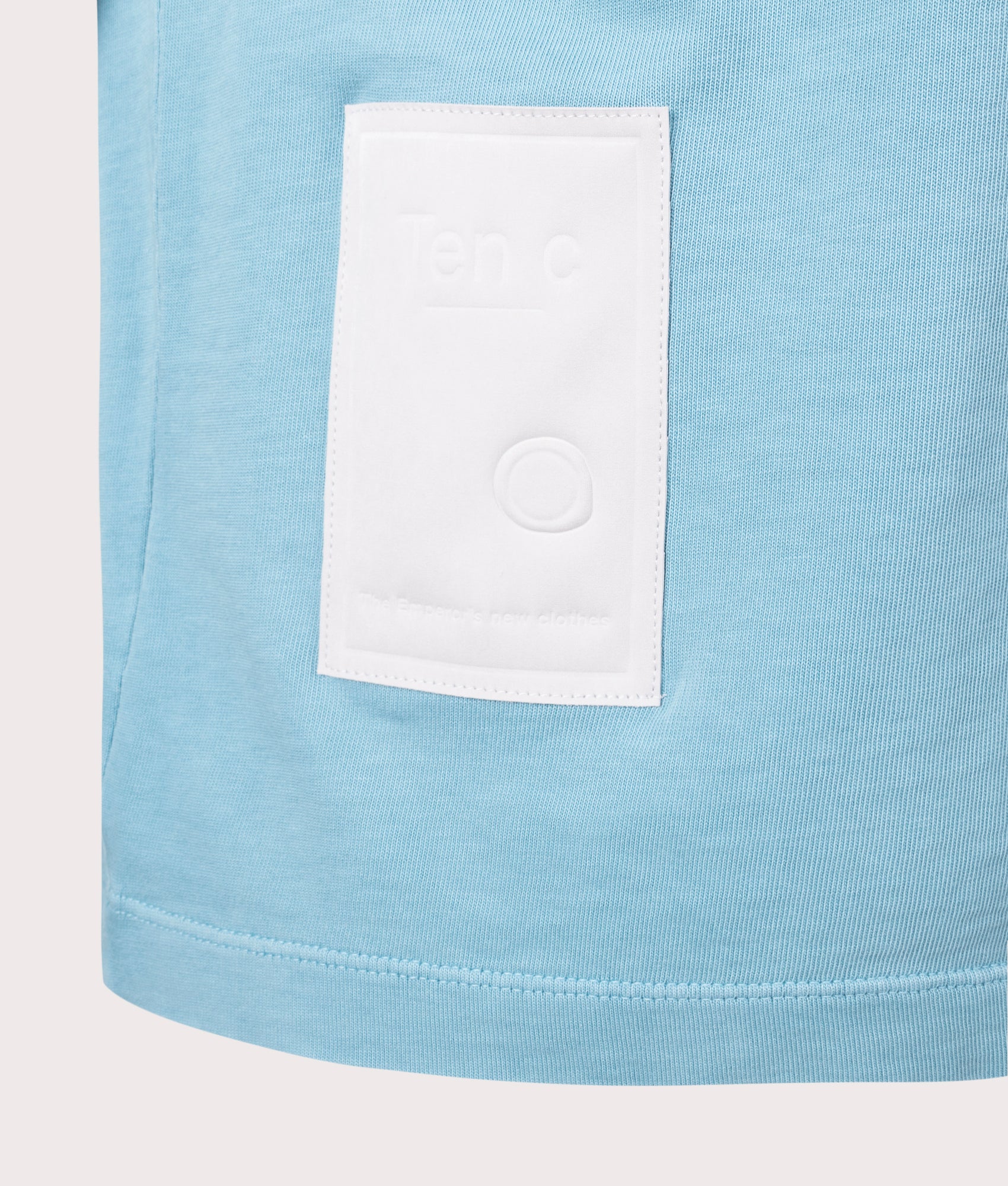 Ten c Mineral Garment Dyed Polo Shirt in Sky Blue Lake, 100% Cotton at EQVVS. Close-up shot.