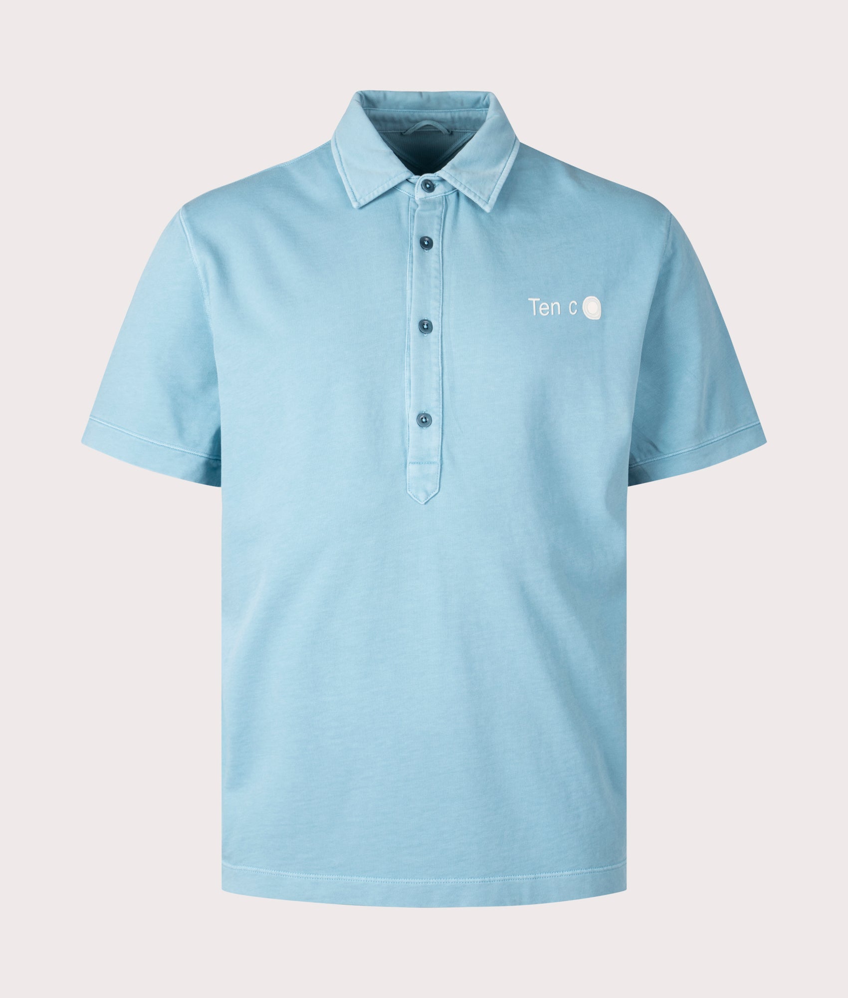 Ten c Mineral Garment Dyed Polo Shirt in Sky Blue Lake, 100% Cotton at EQVVS. Front shot.