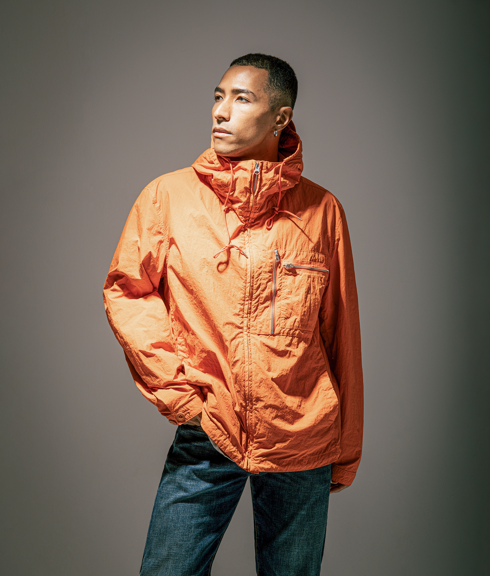 Ten c Garment Dyed Nylon Tactel Lined Jacket by in Orange Koi Carp at EQVVS Menswear. Campaign shot.