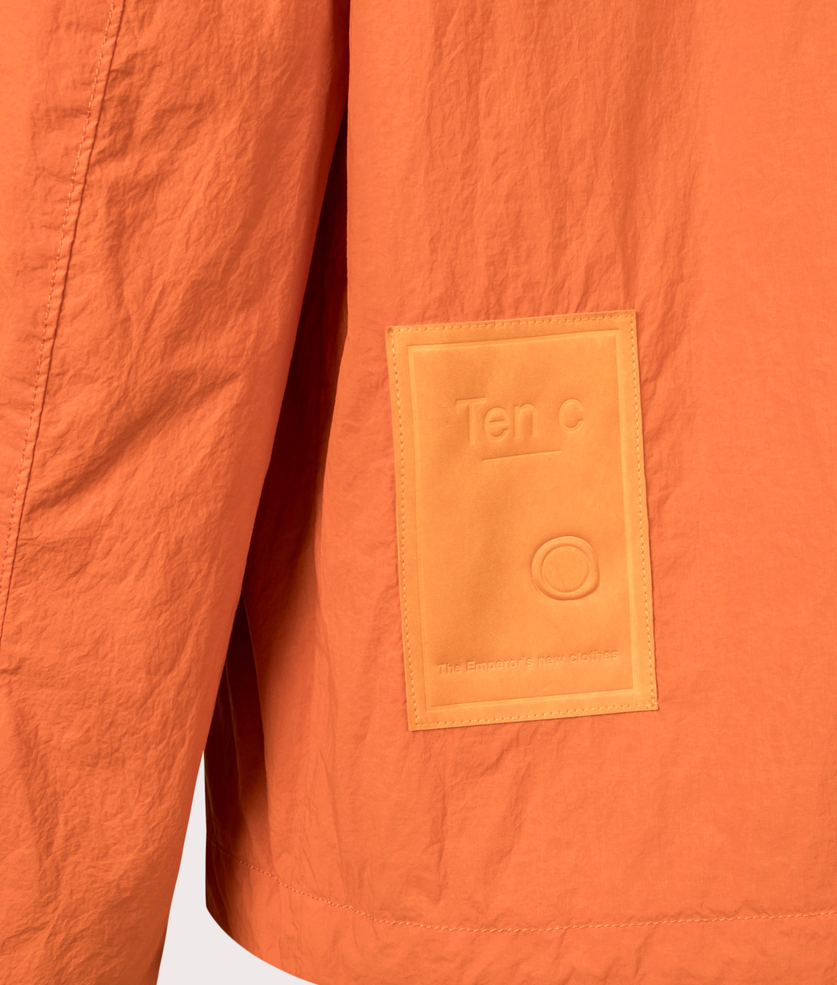 Ten c Garment Dyed Nylon Tactel Lined Jacket by in Orange Koi Carp at EQVVS Menswear. Back Detail shot.