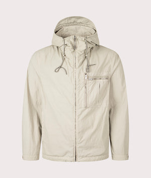 Garment Dyed Nylon Tactel Lined Jacket by Ten c in Pale Taupe. Shot by EQVVS. Front shot.