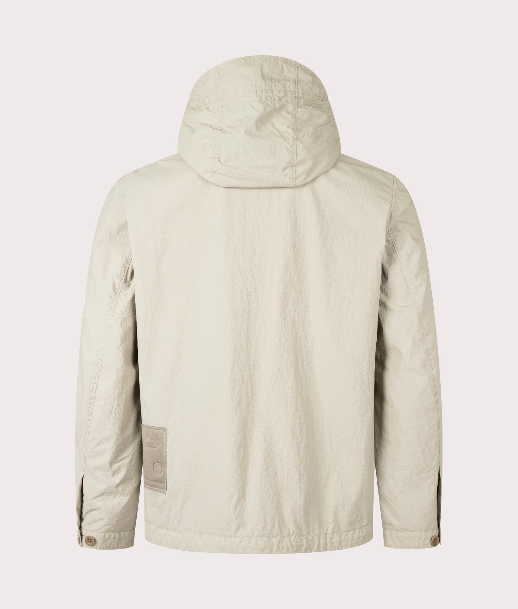 Garment Dyed Nylon Tactel Lined Jacket by Ten c in Pale Taupe. Shot by EQVVS. Back shot.