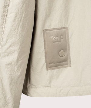 Garment Dyed Nylon Tactel Lined Jacket by Ten c in Pale Taupe. Shot by EQVVS. Back detail shot.