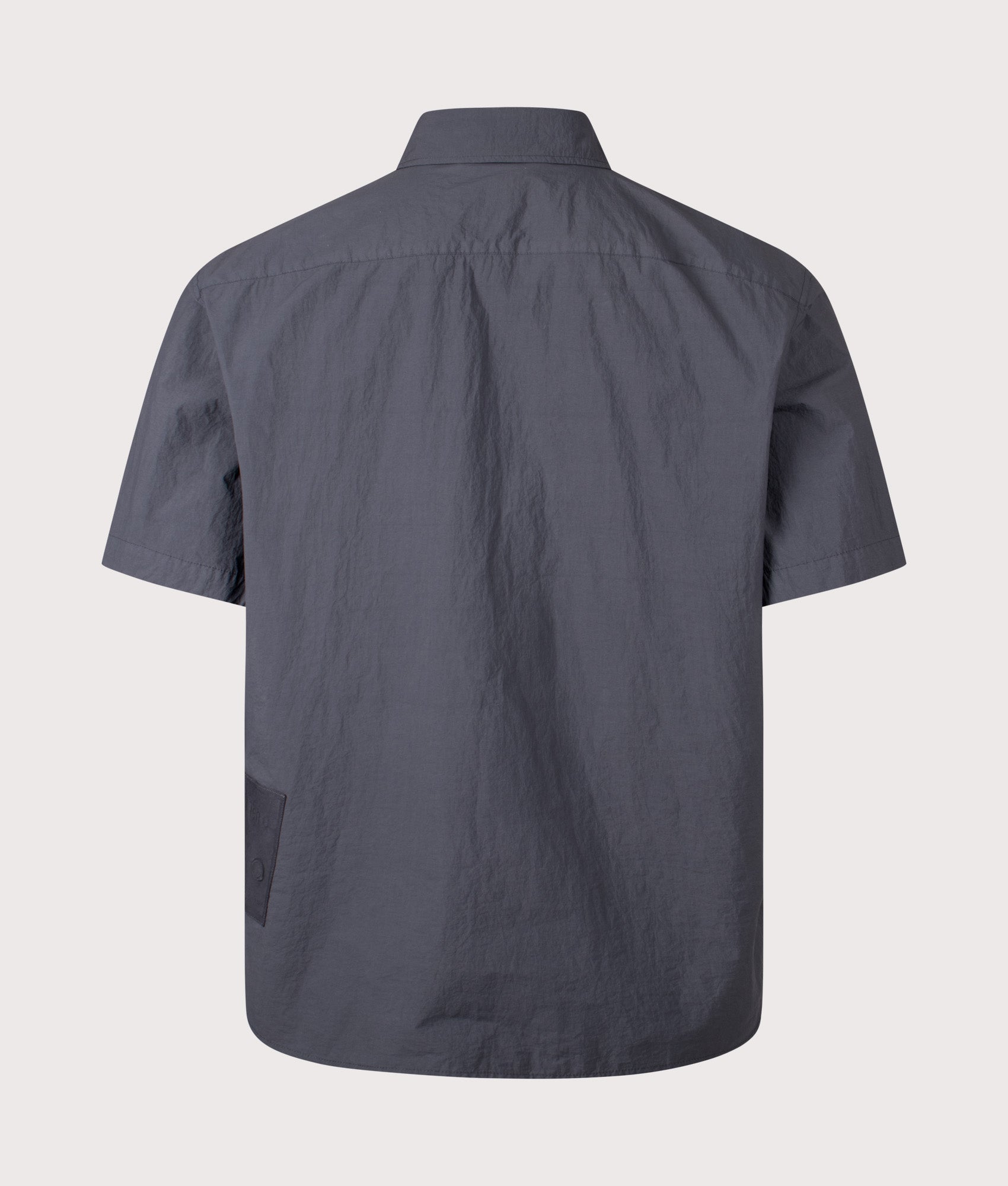 Ten c Garment Dyed Tactel Short Sleeve Shirt in Carbon Grey at EQVVS Menswear. Back shot.