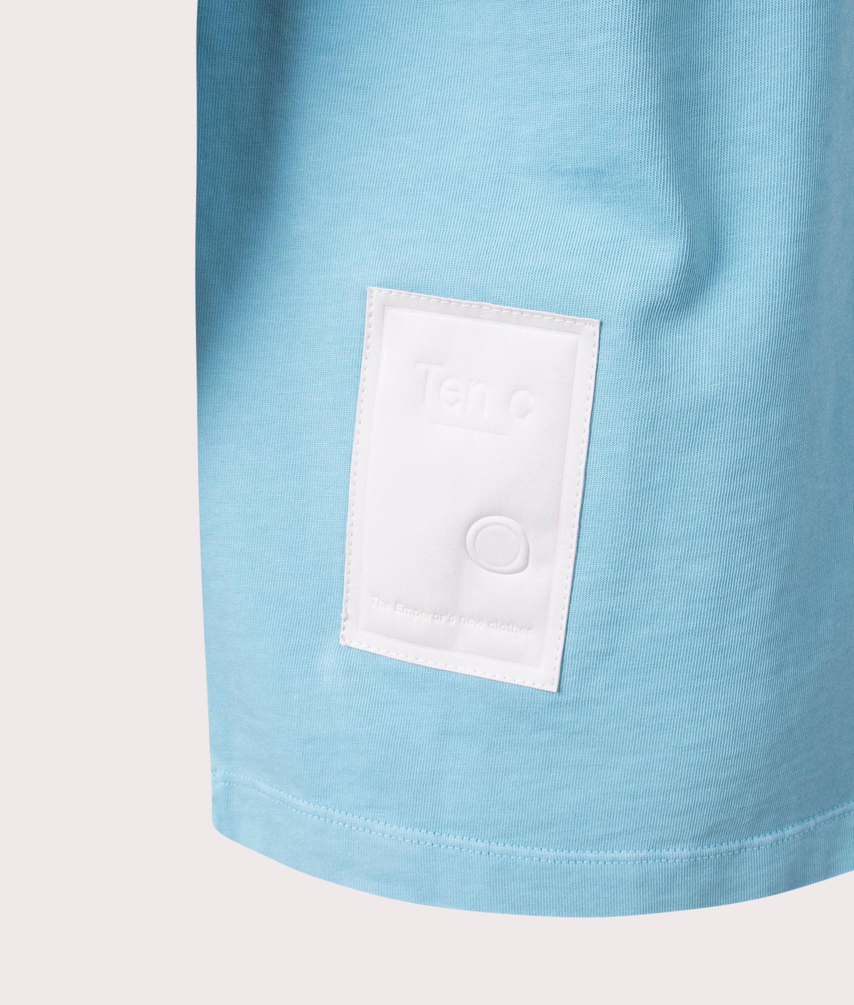 Ten c Mineral Garment Dyed T-Shirt in Sky Blue Lake, 100% Cotton at EQVVS. Close-up shot.