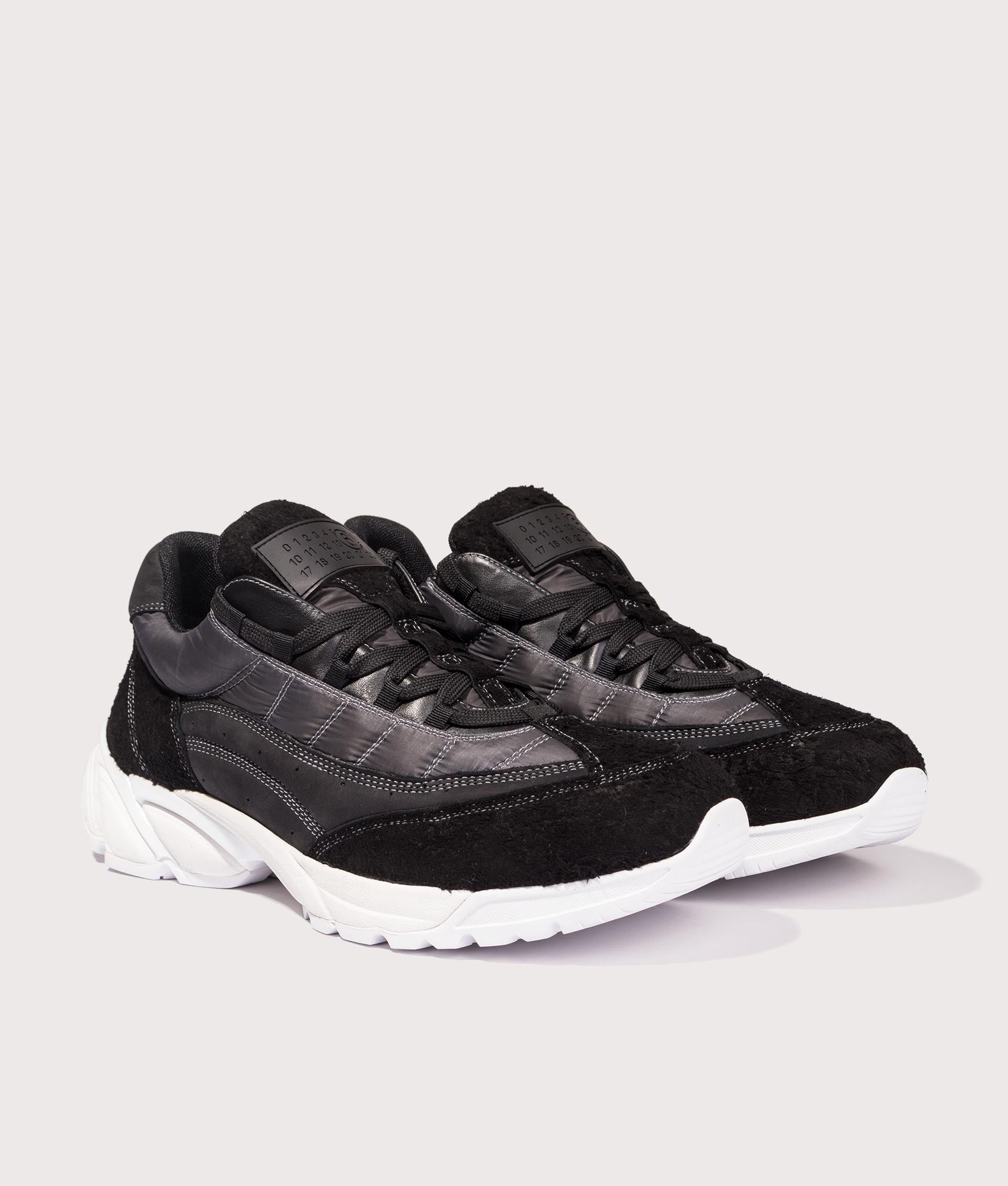 MM6 Sport Sneakers by MM6 in Black. Shot by EQVVS. Front detail shot.