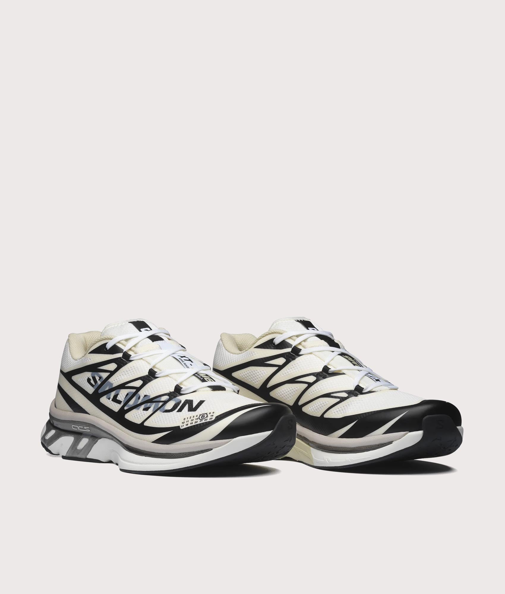 XT-MM6 / SALOMON in Vanilla Ice, Black and Green Haze at EQVVS Menswear. Angled front shot.