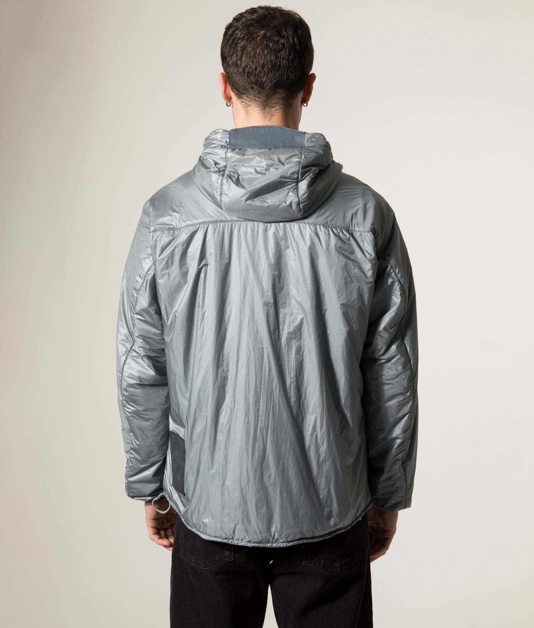 Ten c Piece Dyed Ripstop Primaloft Mid Layer Jacket in Quarry Grey at EQVVS Menswear. Model back shot.
