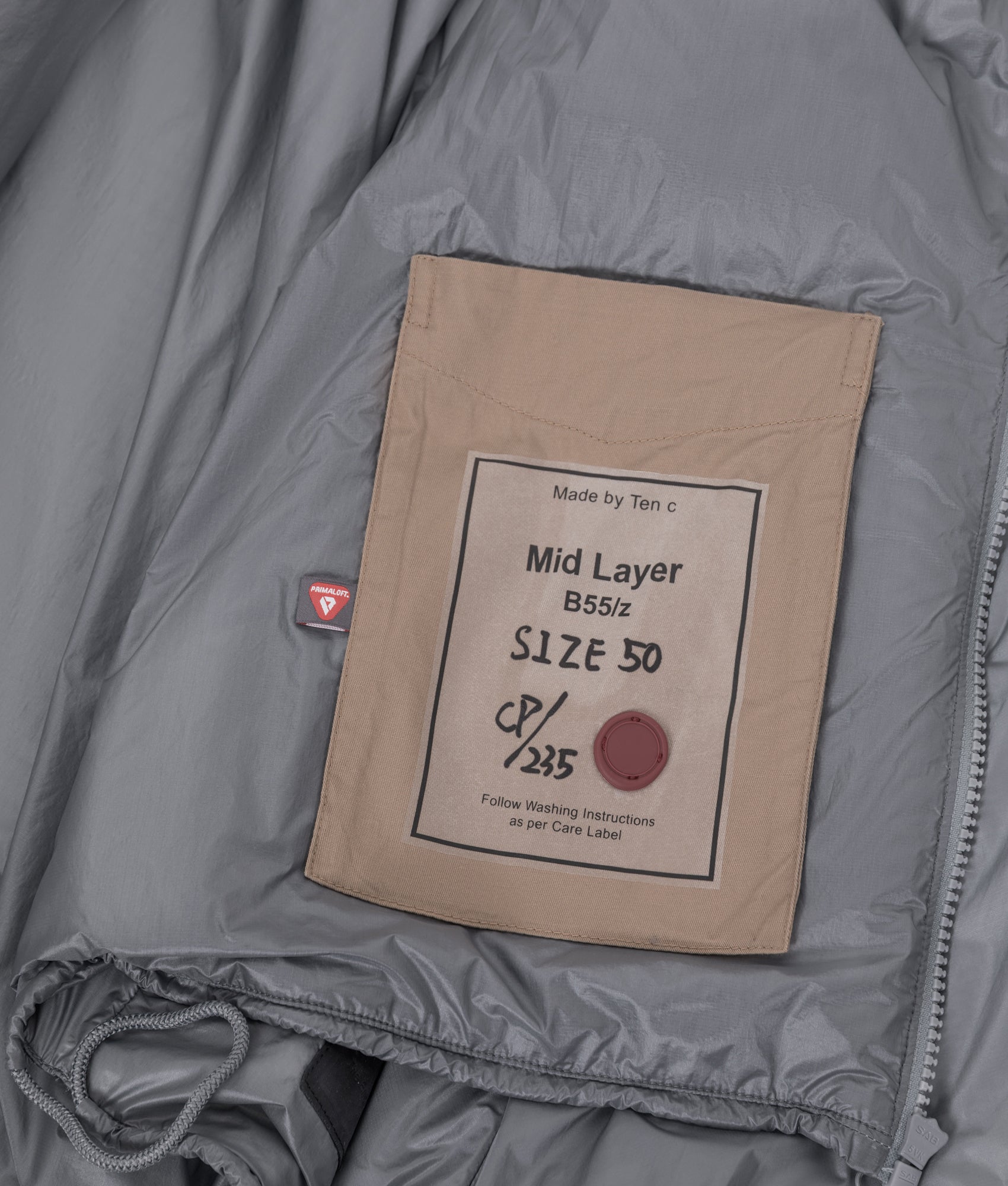 Ten c Piece Dyed Ripstop Primaloft Mid Layer Jacket in Quarry Grey at EQVVS Menswear. Internal detail shot.