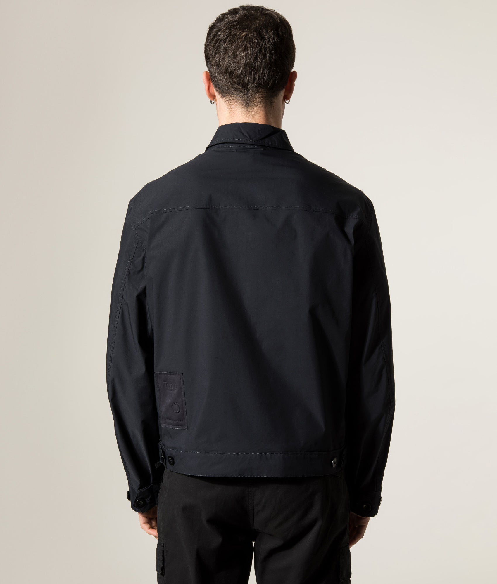 Ten c Piece Dyed Mid Layer Overshirt in Blue at EQVVS Menswear. Model back shot.