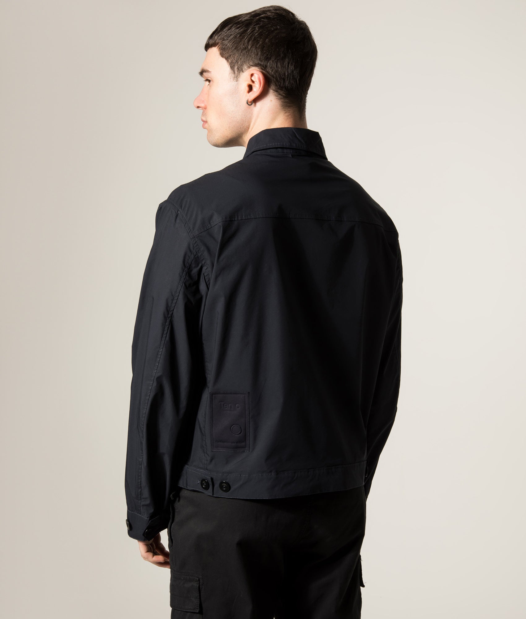 Ten c Piece Dyed Mid Layer Overshirt in Blue at EQVVS Menswear. Model angled back shot.
