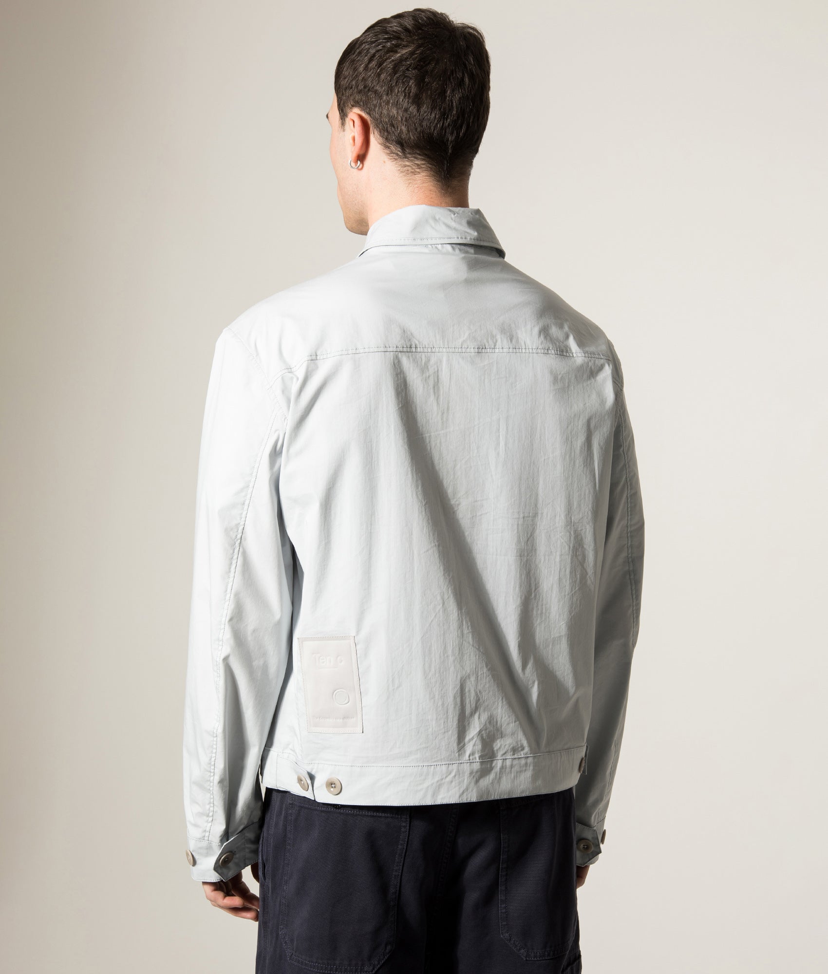 Ten c Piece Dyed Mid Layer Overshirt in Grey Microchip at EQVVS Menswear. Angled model back shot.