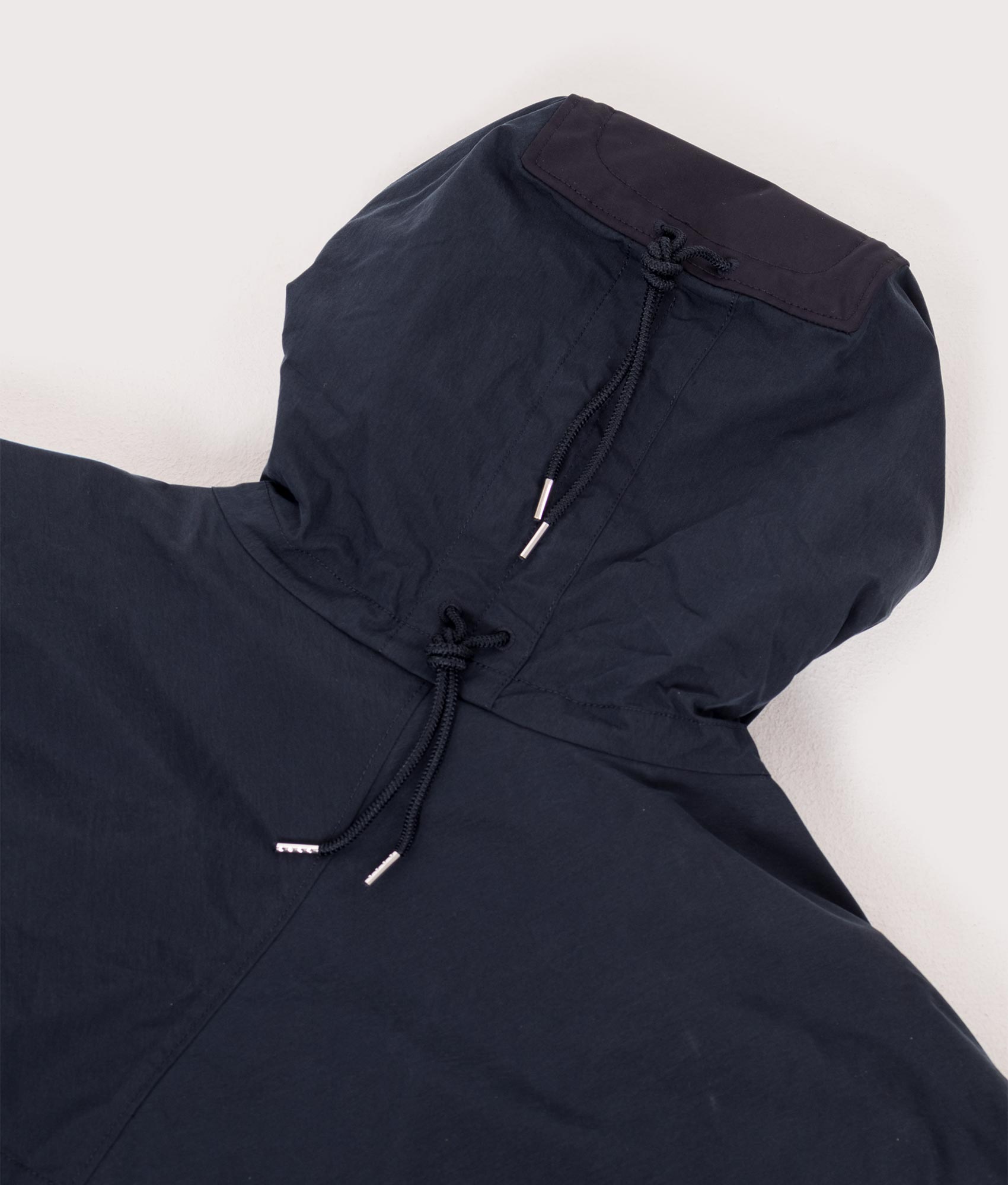 Ten c Piece Dyed OJJ Mid Layer Jacket in Blue at EQVVS Menswear. Hood detail shot.