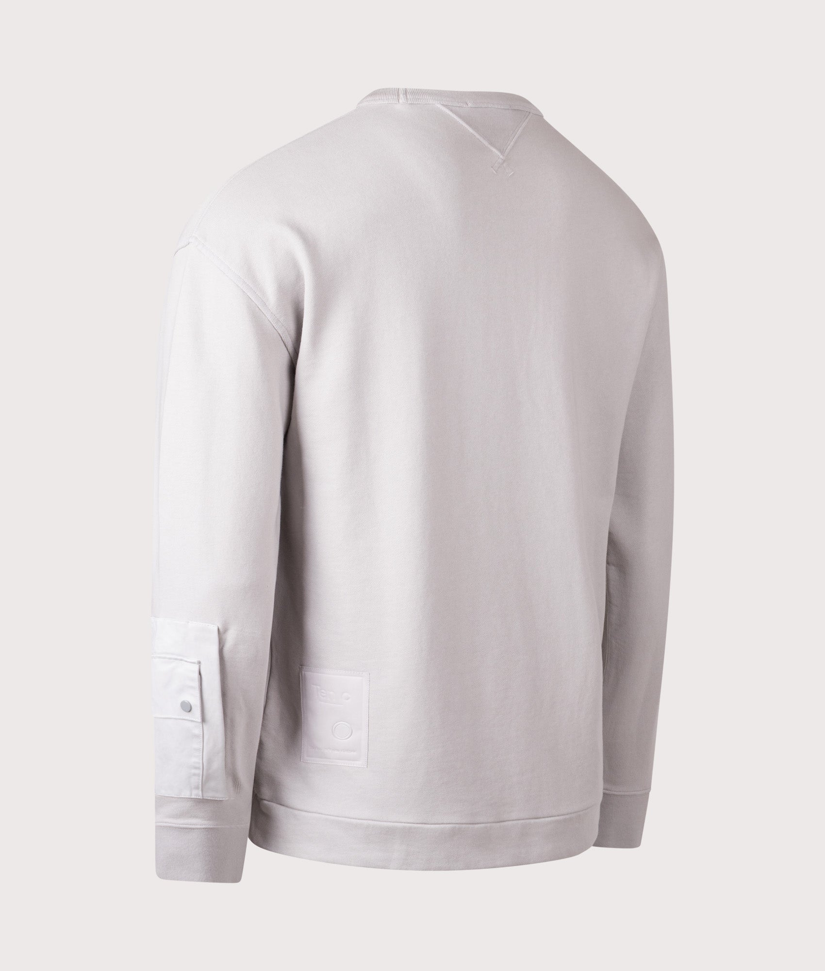 Ten c Garment Dyed Diagonal Fleece Sweatshirt in Grey Cloud at EQVVS Menswear. Angled back shot.