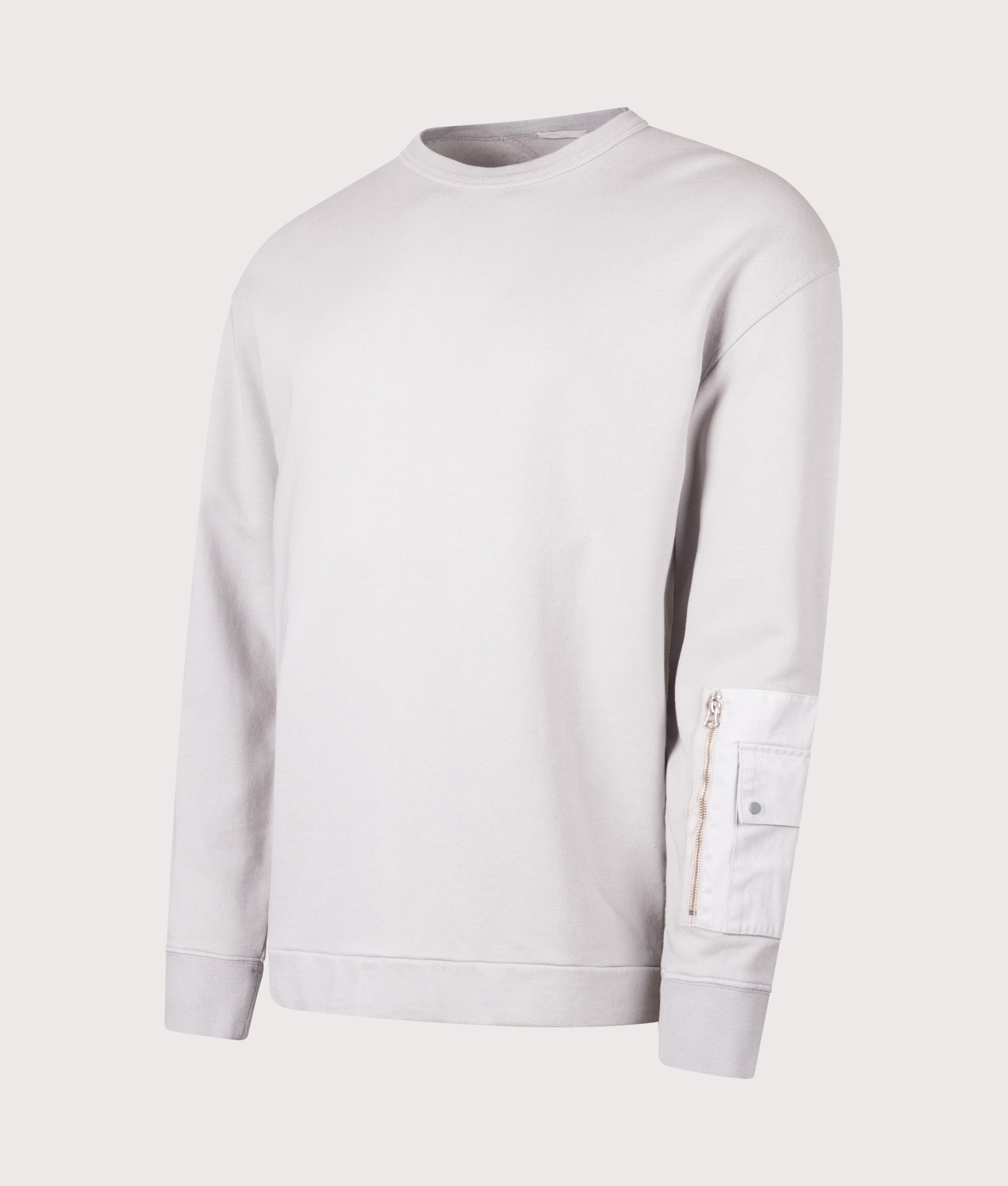 Ten c Garment Dyed Diagonal Fleece Sweatshirt in Grey Cloud at EQVVS Menswear. Angled front shot.