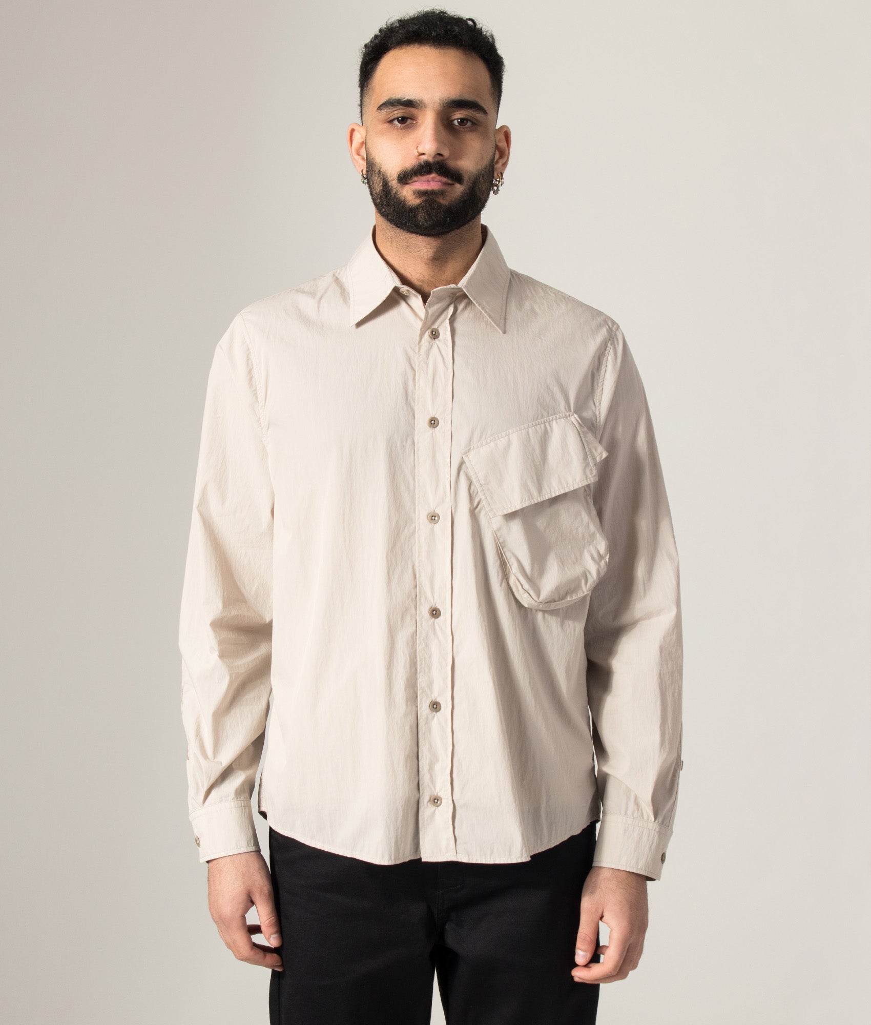 Ten c Piece Dyed Pocket Shirt in Grey Sand at EQVVS Menswear. Model front shot.