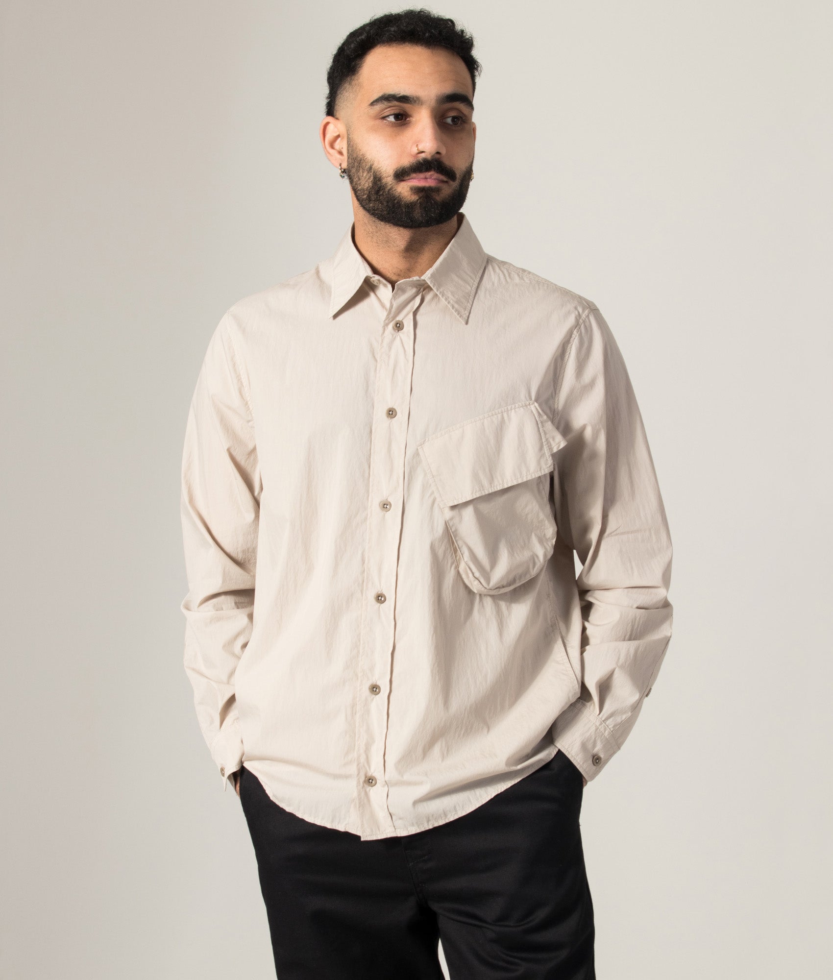 Ten c Piece Dyed Pocket Shirt in Grey Sand at EQVVS Menswear. Model front shot.