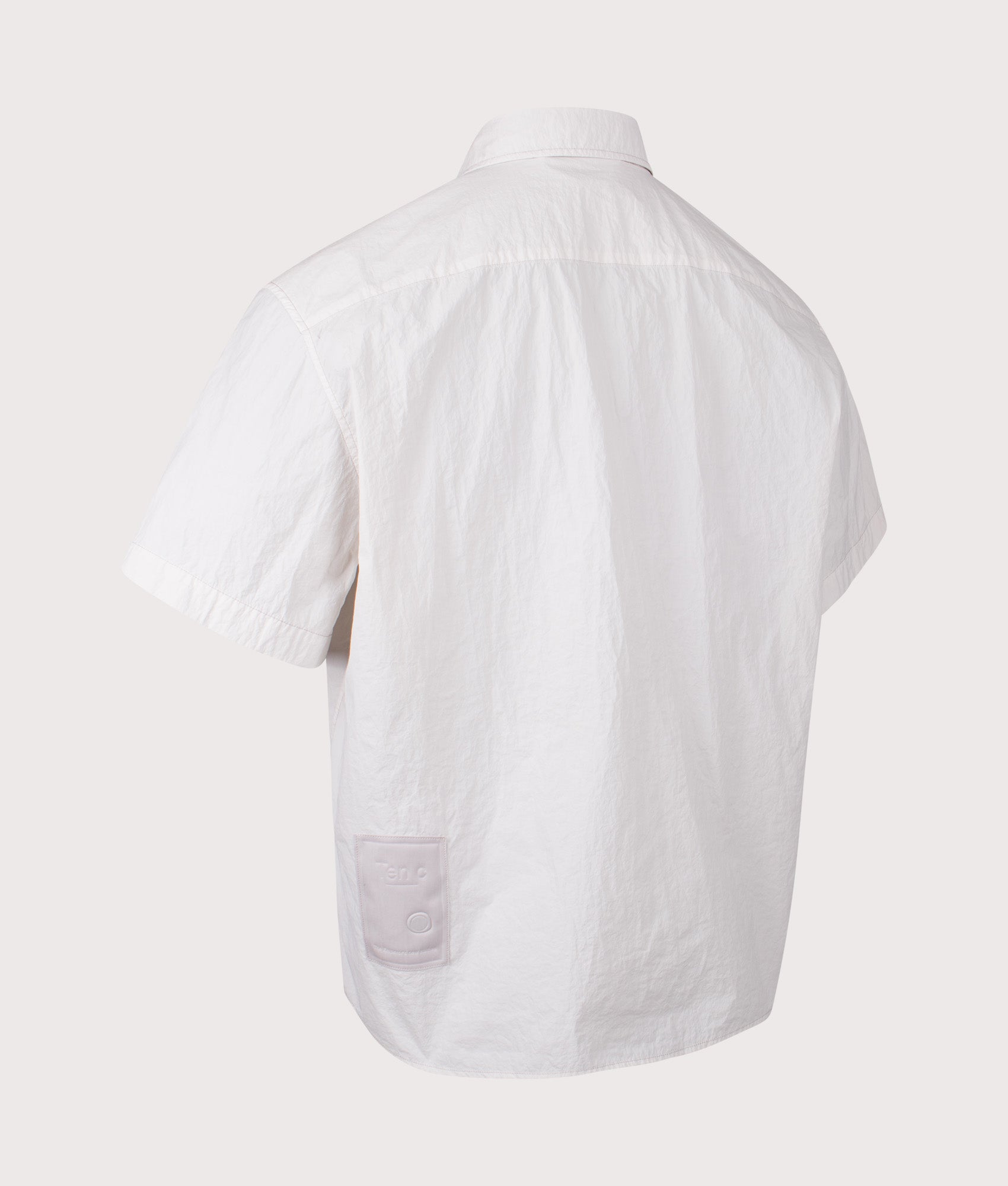 Ten c Garment Dyed Tactel Short Sleeve Shirt in Grey Cloud at EQVVS Menswear. Angled back shot.