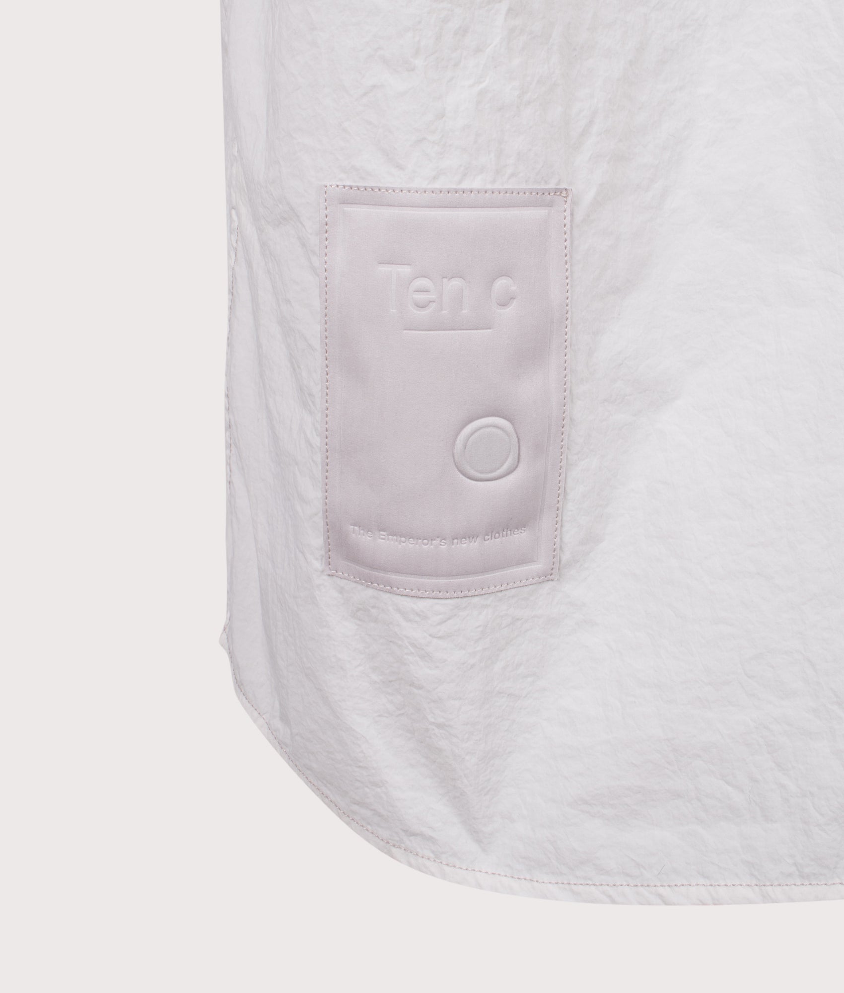 Ten c Garment Dyed Tactel Short Sleeve Shirt in Grey Cloud at EQVVS Menswear. Back shot.