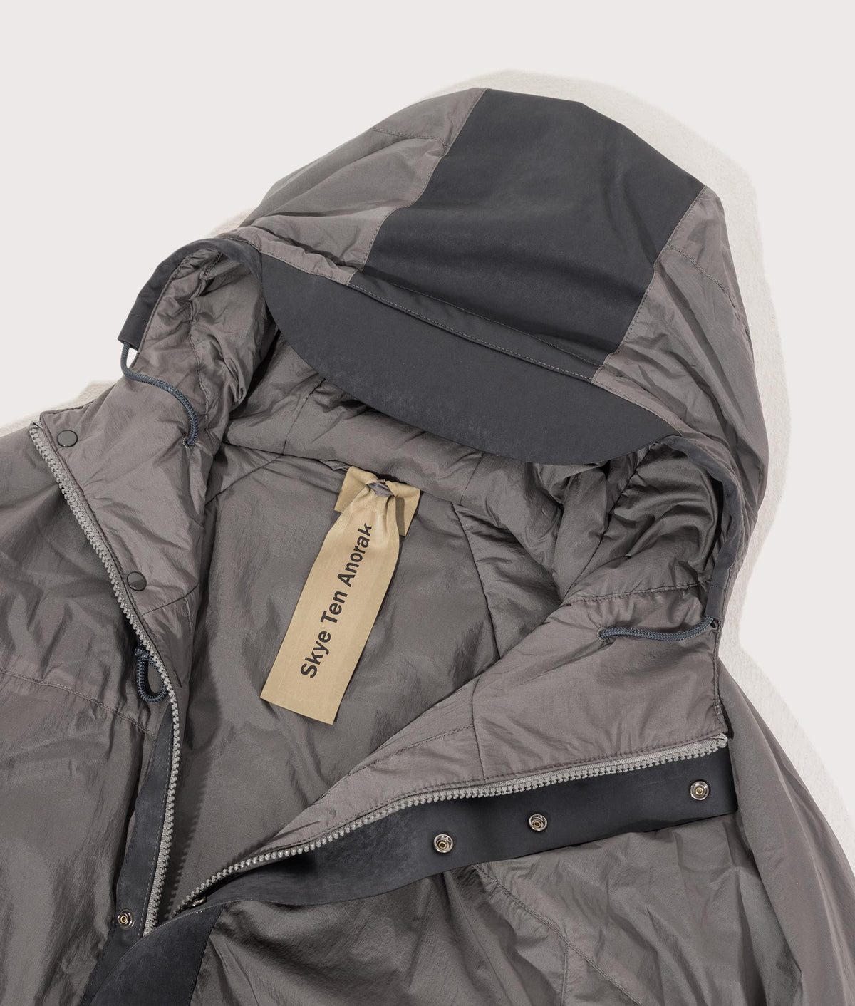 Lightly Padded Skye Ten Anorak Jacket by Ten c in Iron Grey. Shot by EQVVS. Detail shot.