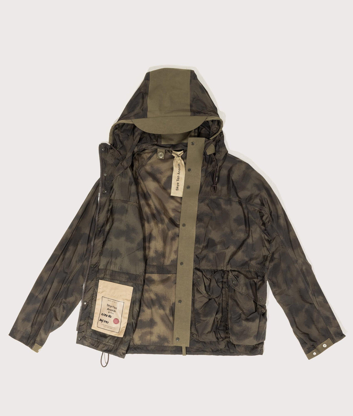 Camou Skye Ten Anorak Jacket by Ten c in Olive Green. Shot by EQVVS. Flat shot.