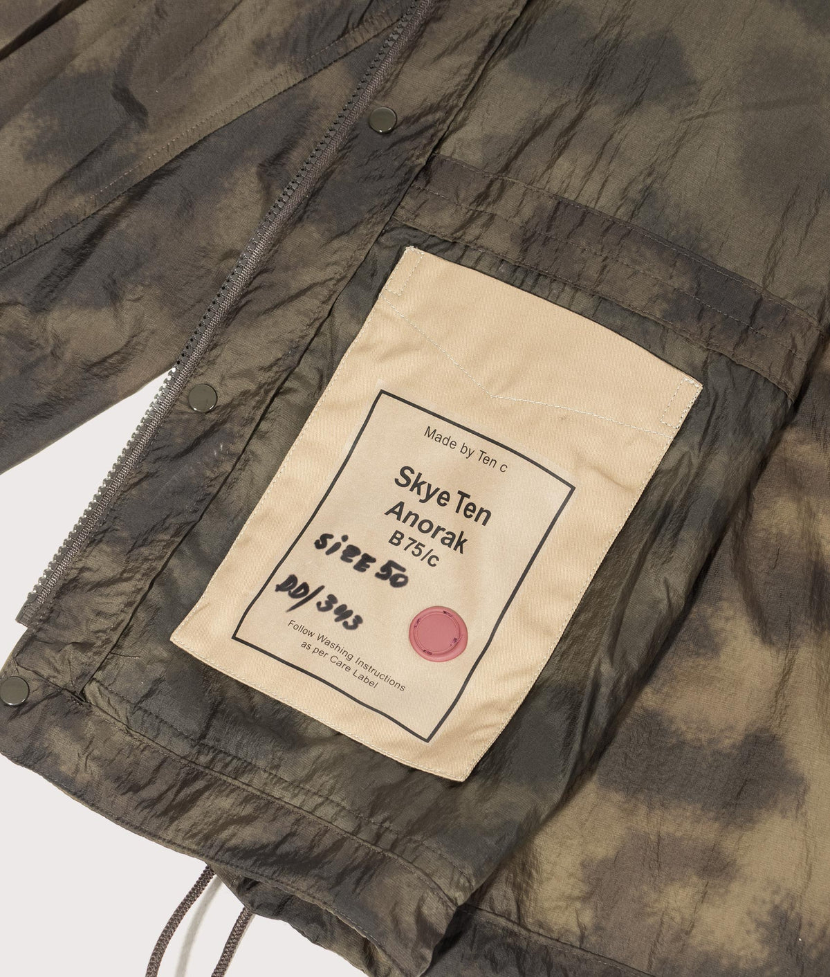 Camou Skye Ten Anorak Jacket by Ten c in Olive Green. Shot by EQVVS. Inner label shot.