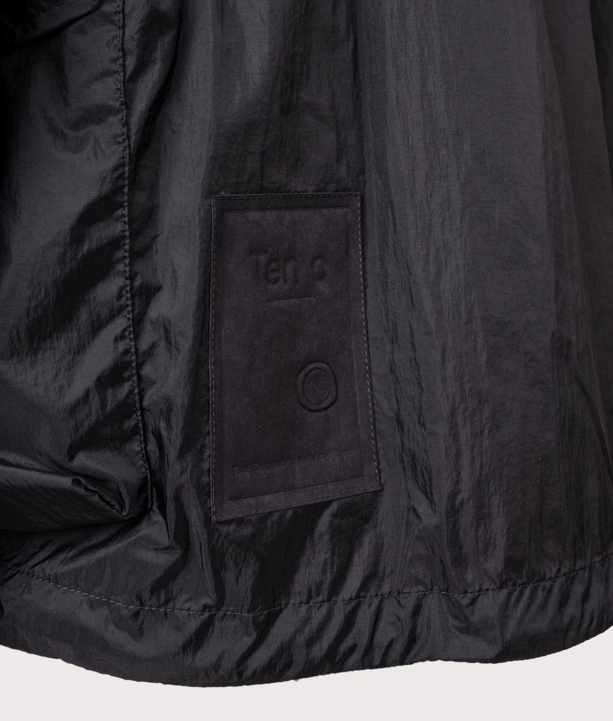 Skye Ten Anorak Jacket by Ten c in Black. Shot by EQVVS. Badge detail shot.