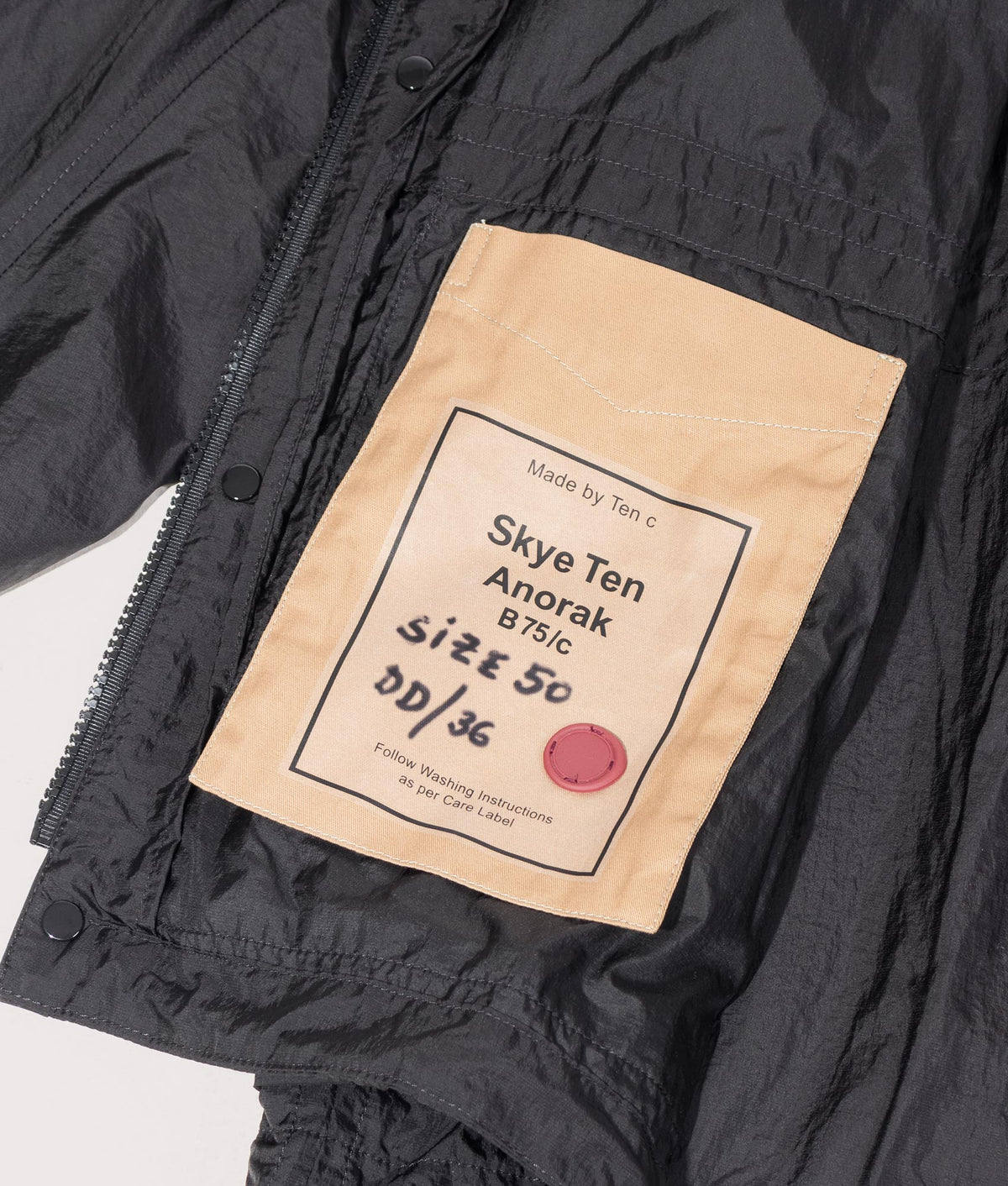 Skye Ten Anorak Jacket by Ten c in Black. Shot by EQVVS. Inner label shot.