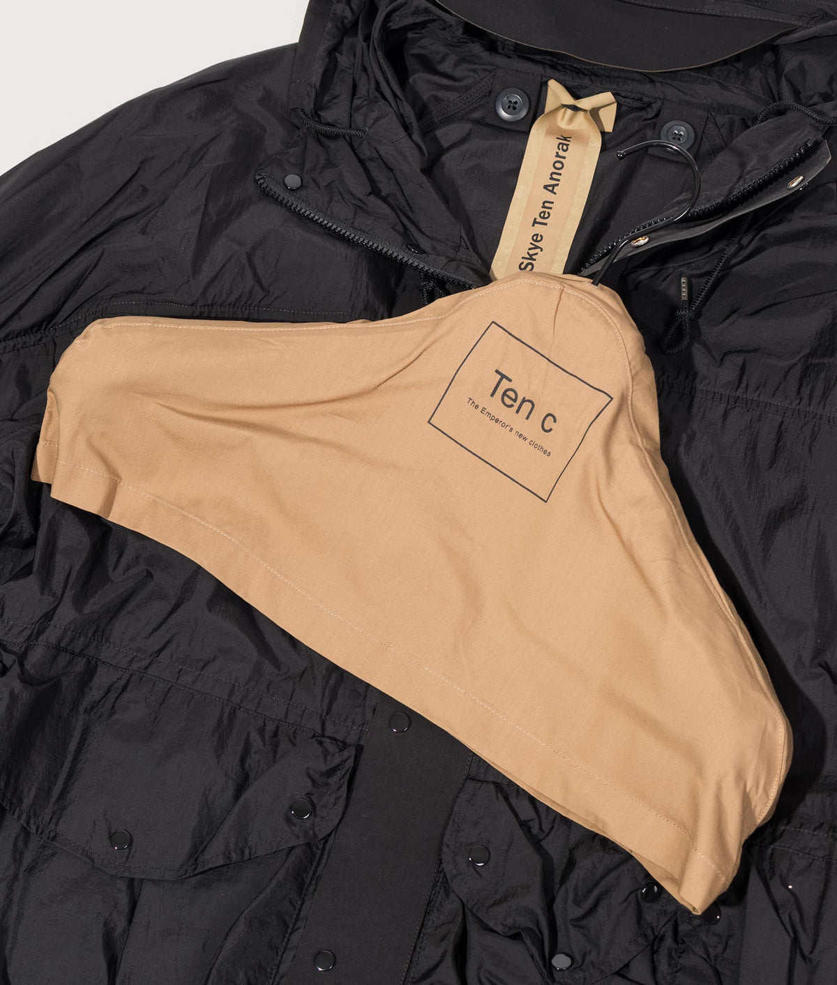 Skye Ten Anorak Jacket by Ten c in Black. Shot by EQVVS. Branded hanger shot.