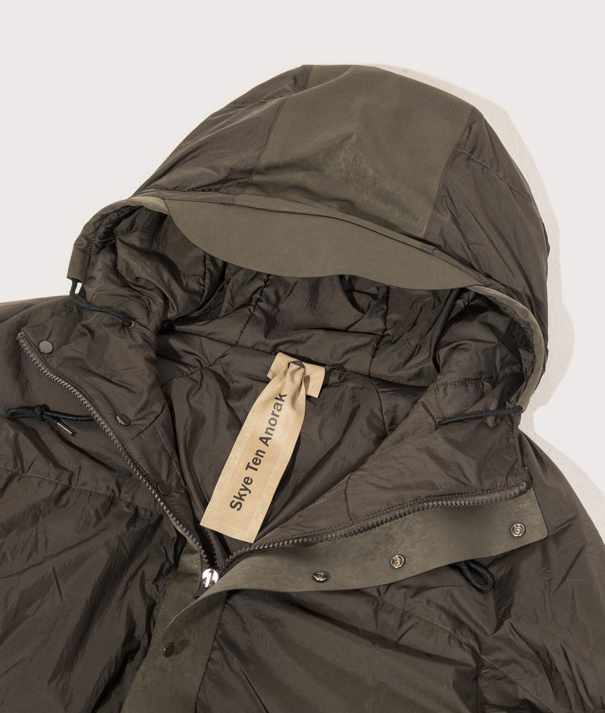 Lightly Padded Skye Ten Anorak Jacket by Ten c in Green Lizard. Shot by EQVVS. Detail shot.