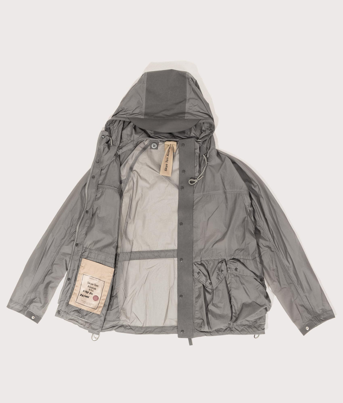 Skye Ten Anorak Jacket by Ten c in Iron Grey. Shot by EQVVS. Flat shot.