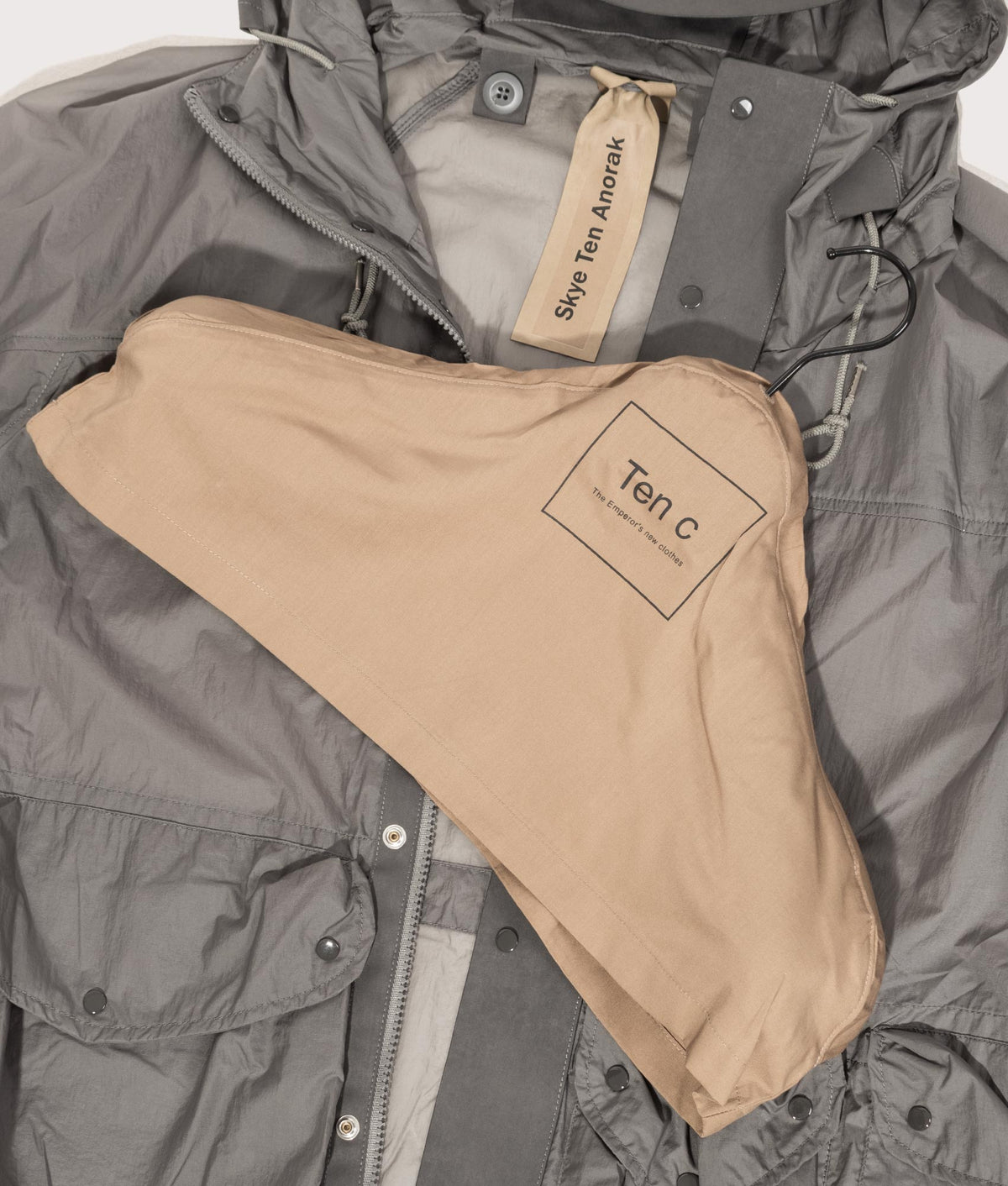 Skye Ten Anorak Jacket by Ten c in Iron Grey. Shot by EQVVS. Branded hanger shot.